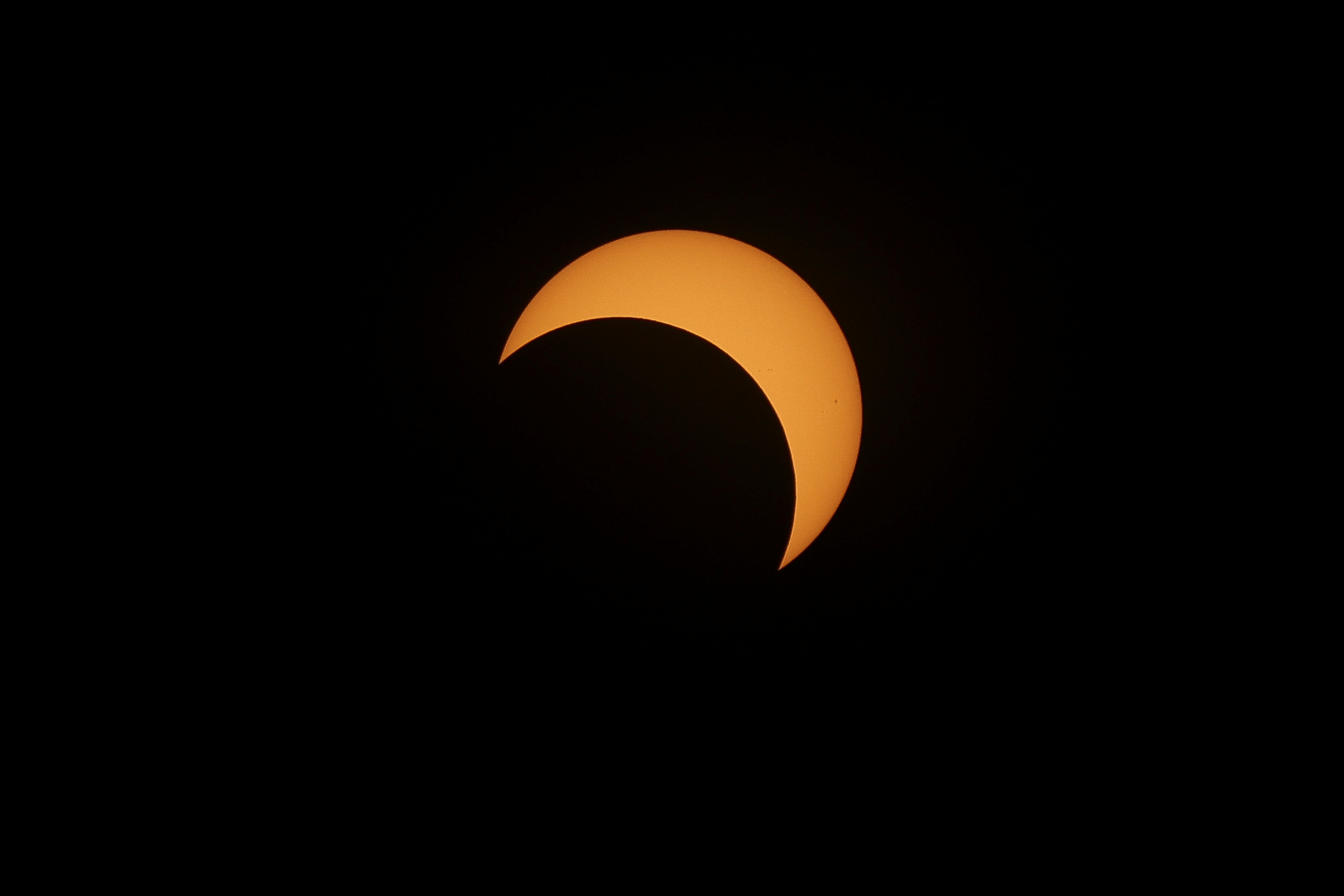 Annular solar eclipse transfixes crowds across the Americas | Reuters