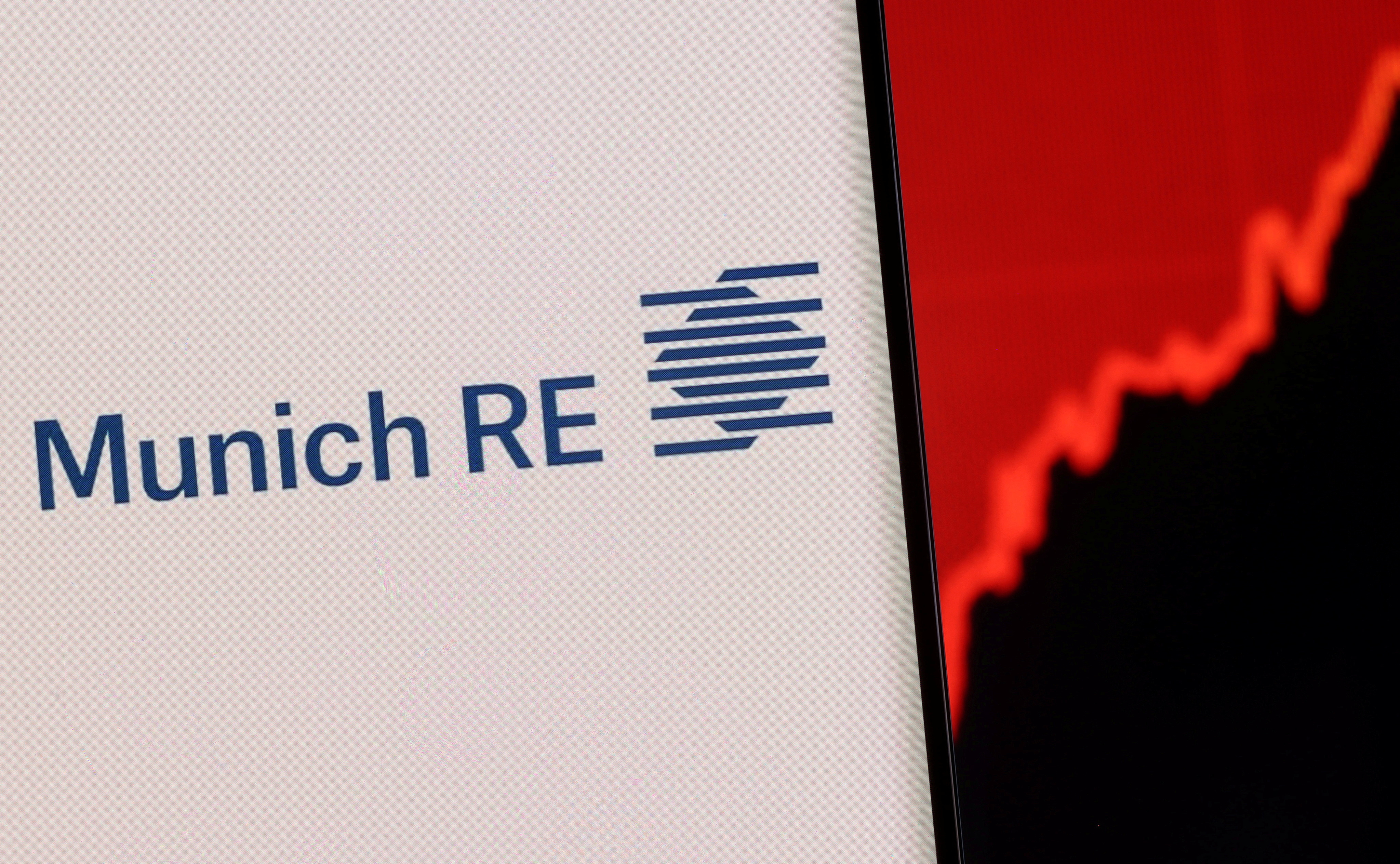 Illustration shows a smartphone with displayed Munich Re Group logo and stock graph