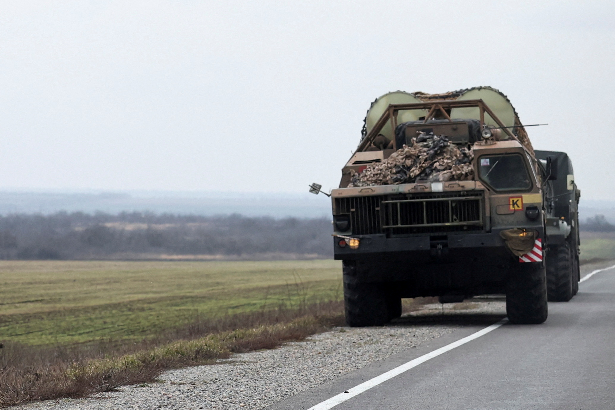 A Ukrainian rocket launcher vehicle drives west of Mariupol