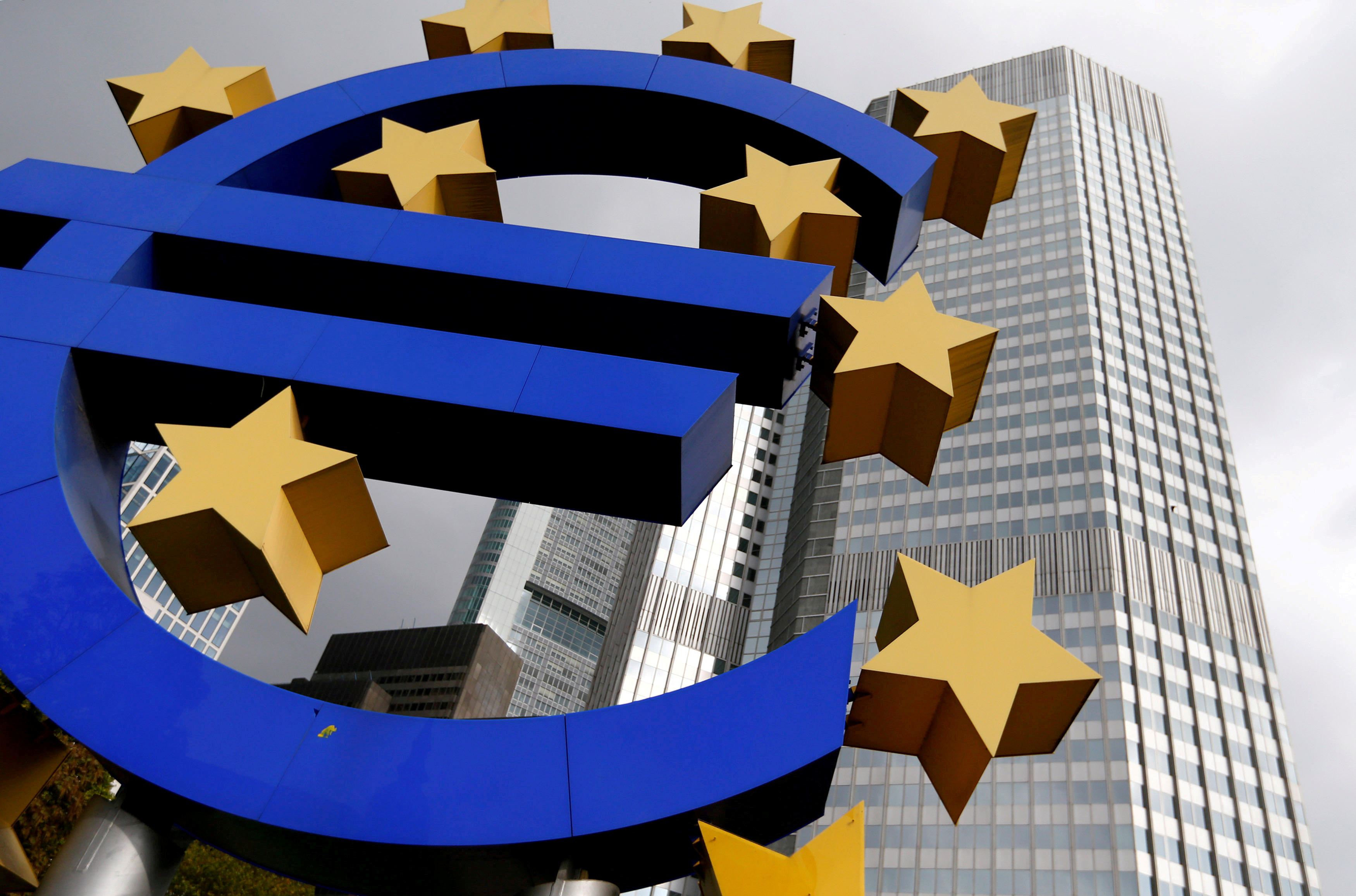A euro logo sculpture stands in front the headquarters of the European Central Bank  in Frankfurt, Germany