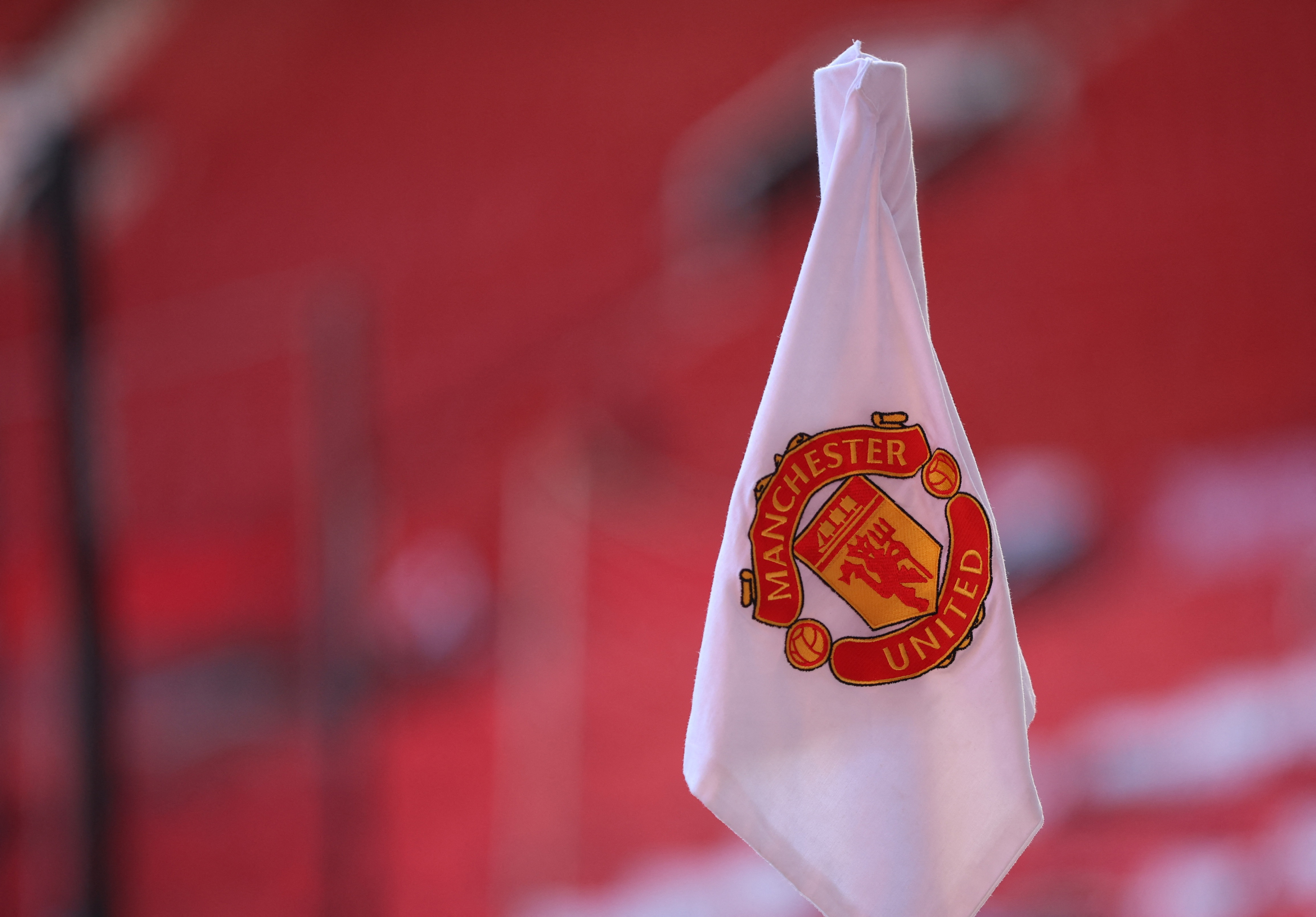 Manchester United cuts profit forecast after Champions League exit