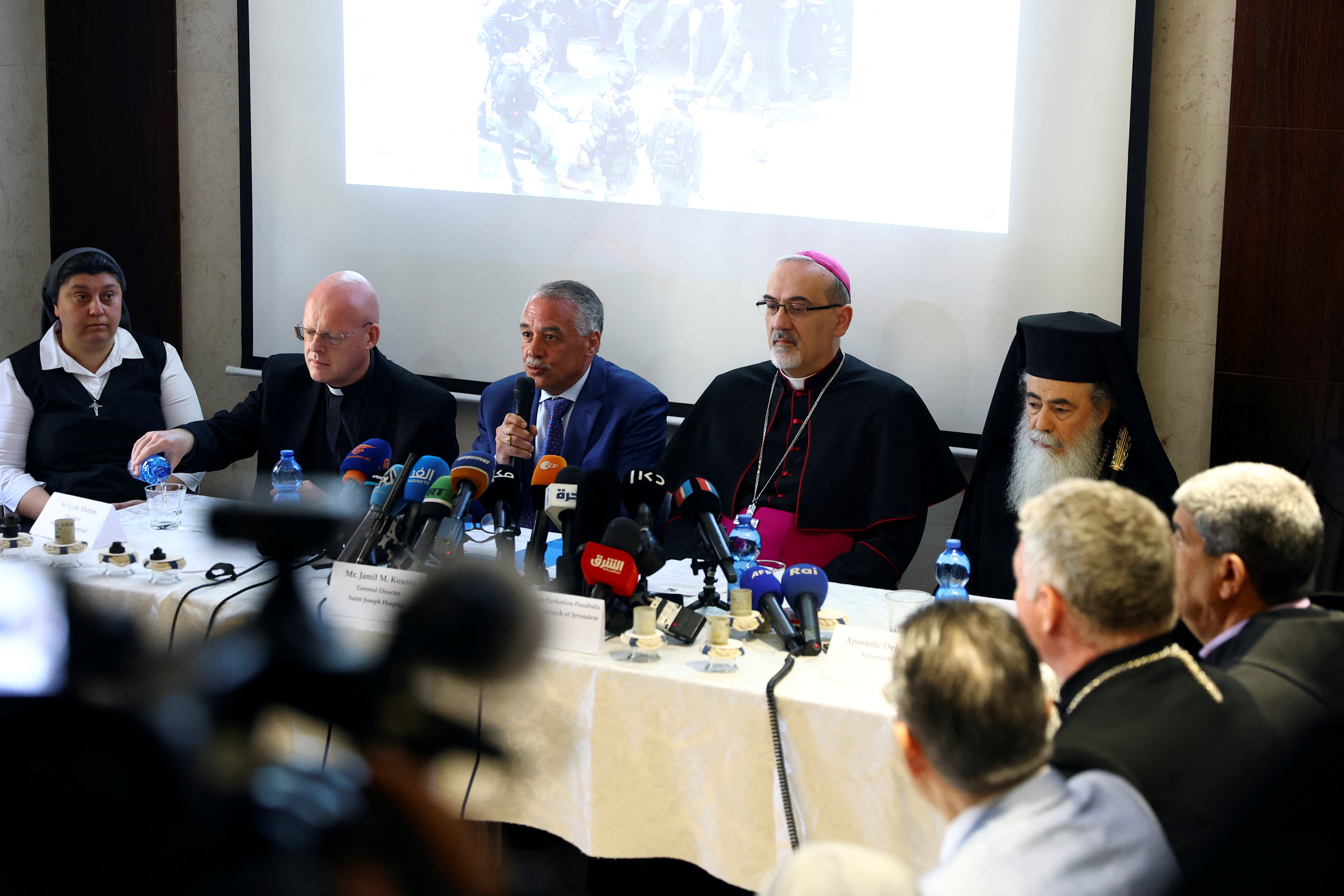 Spiritual leaders attend a news conference regarding the funeral of Al Jazeera reporter Shireen Abu Akleh, in Jerusalem
