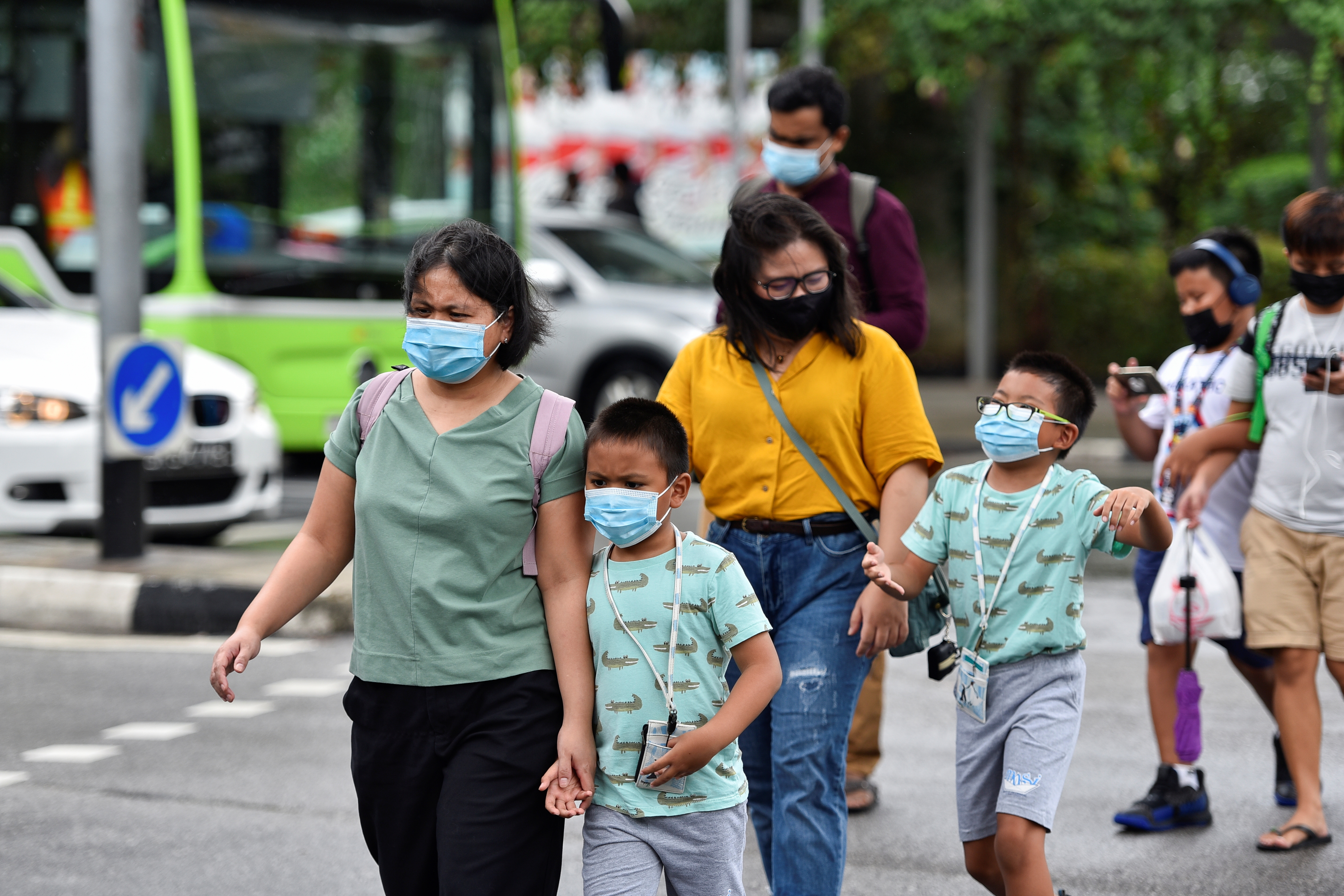 Singapore warns children susceptible to virus variants, shuts schools |  Reuters
