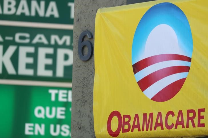 A sign on an insurance store advertises Obamacare in San Ysidro