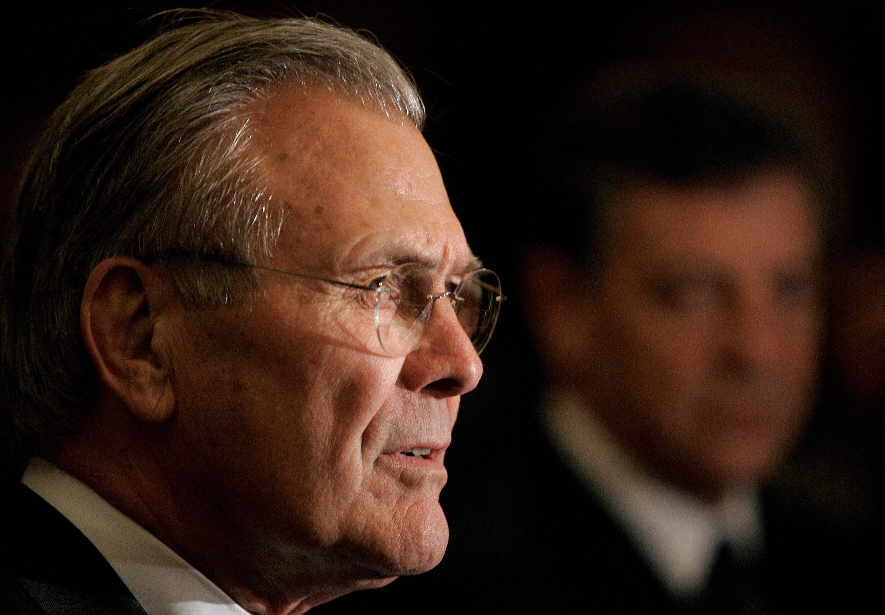 US Secretary of Defence Rumsfeld answer questions during a news conference in Singapore.