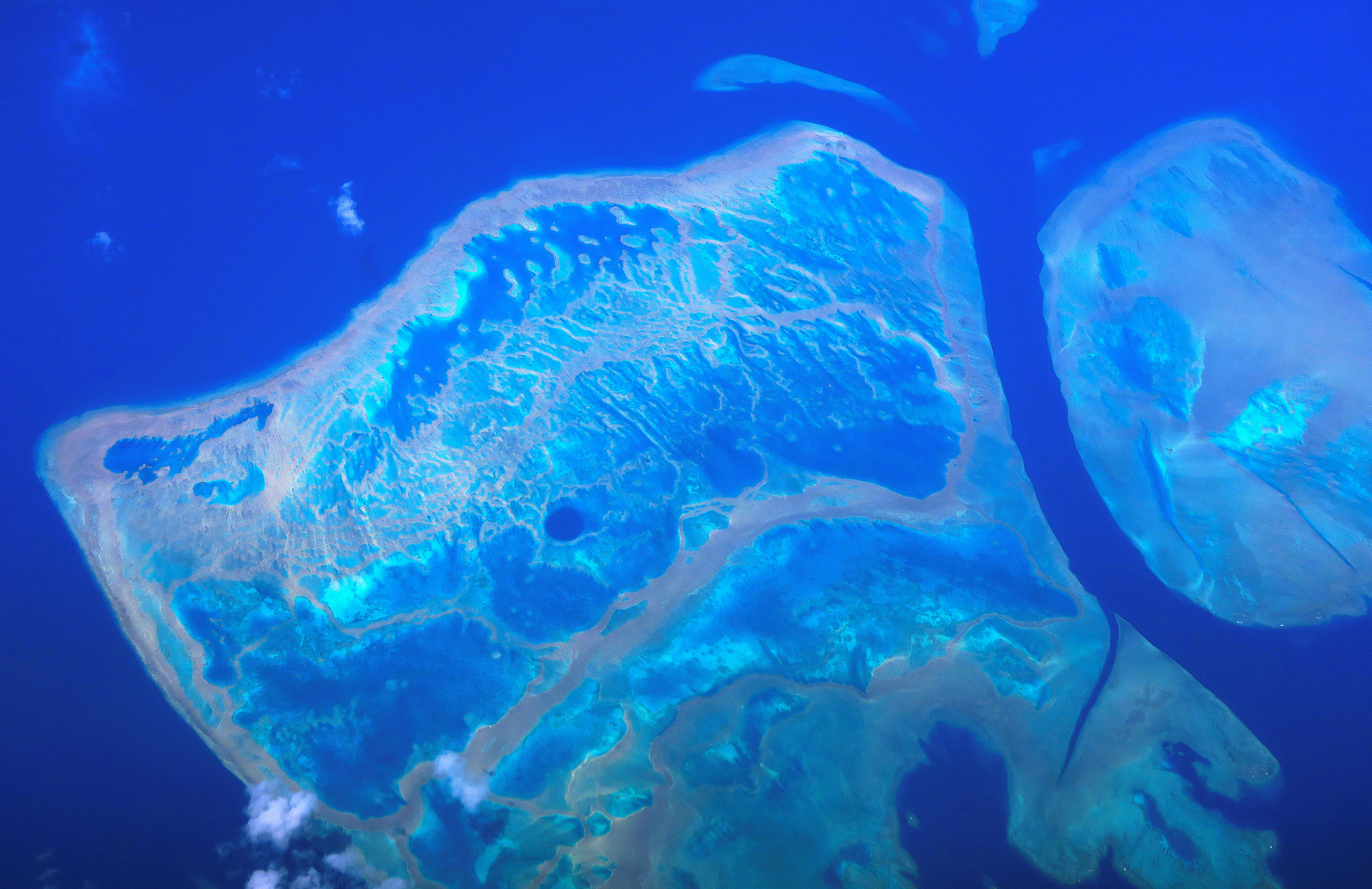 Coral reefs can be seen from above on the Great Barrier Reef, located off the coast of Queensland, near the town of Rockhampton