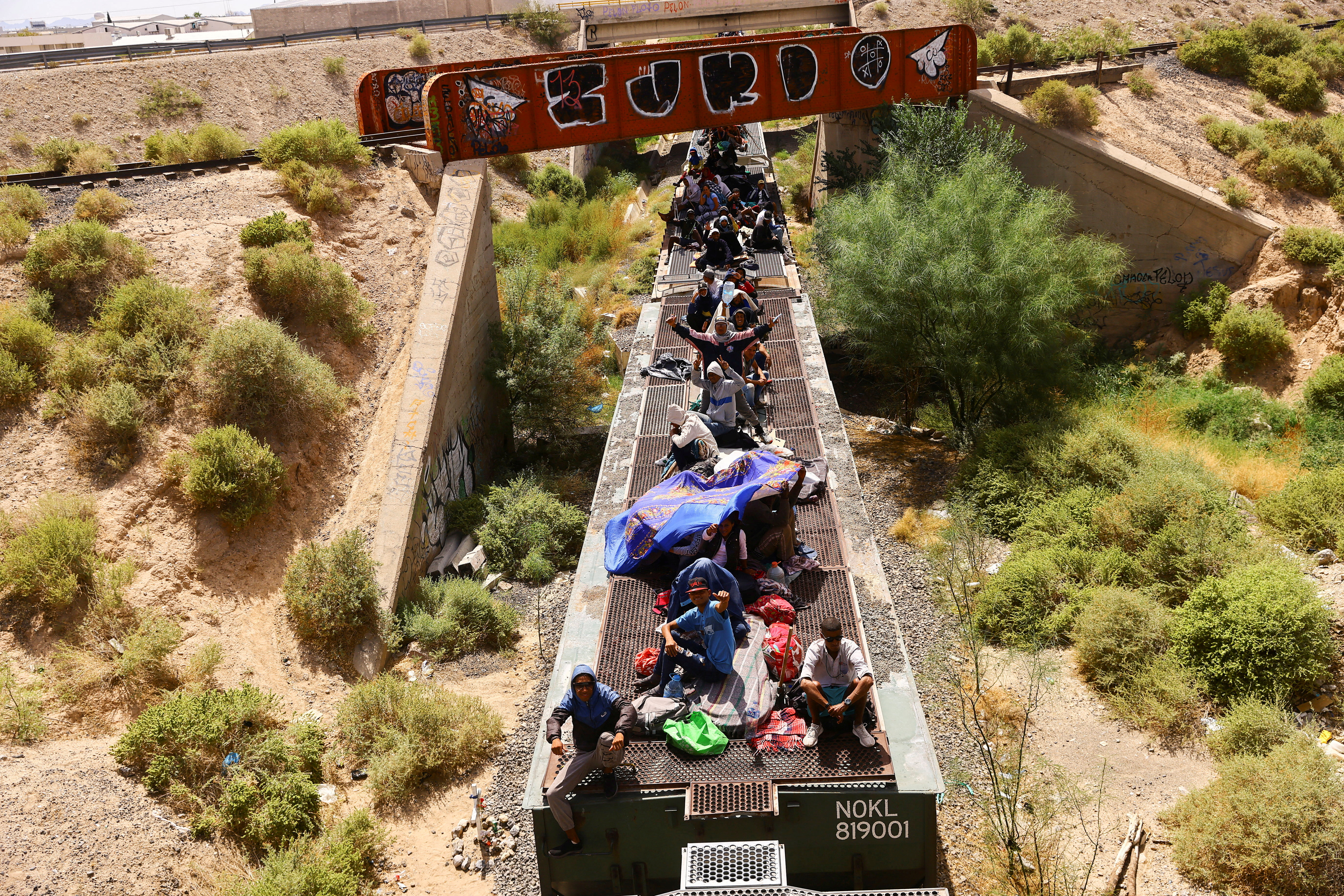 Migrants travel on a train with the intention of reaching the United States, in Ciudad Juarez