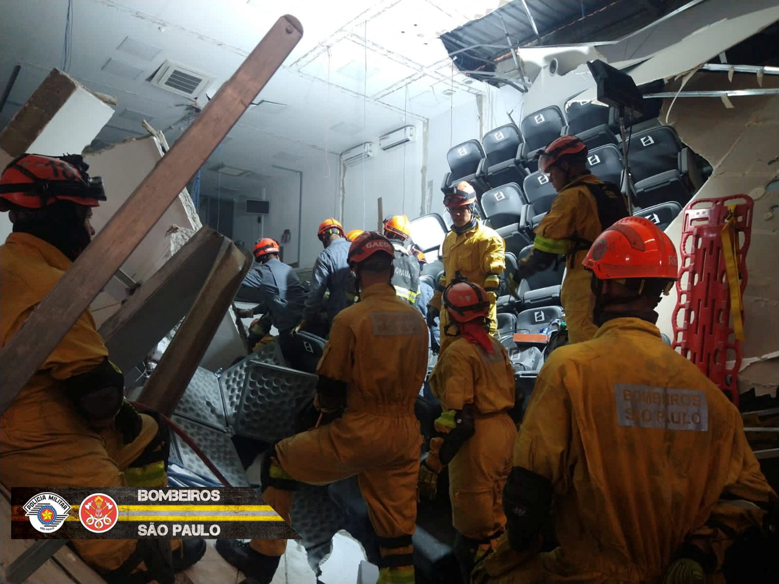 Members of the Fire Department of the State of Sao Paolo work after part of a warehouse collapsed in Itapecerica da Serra