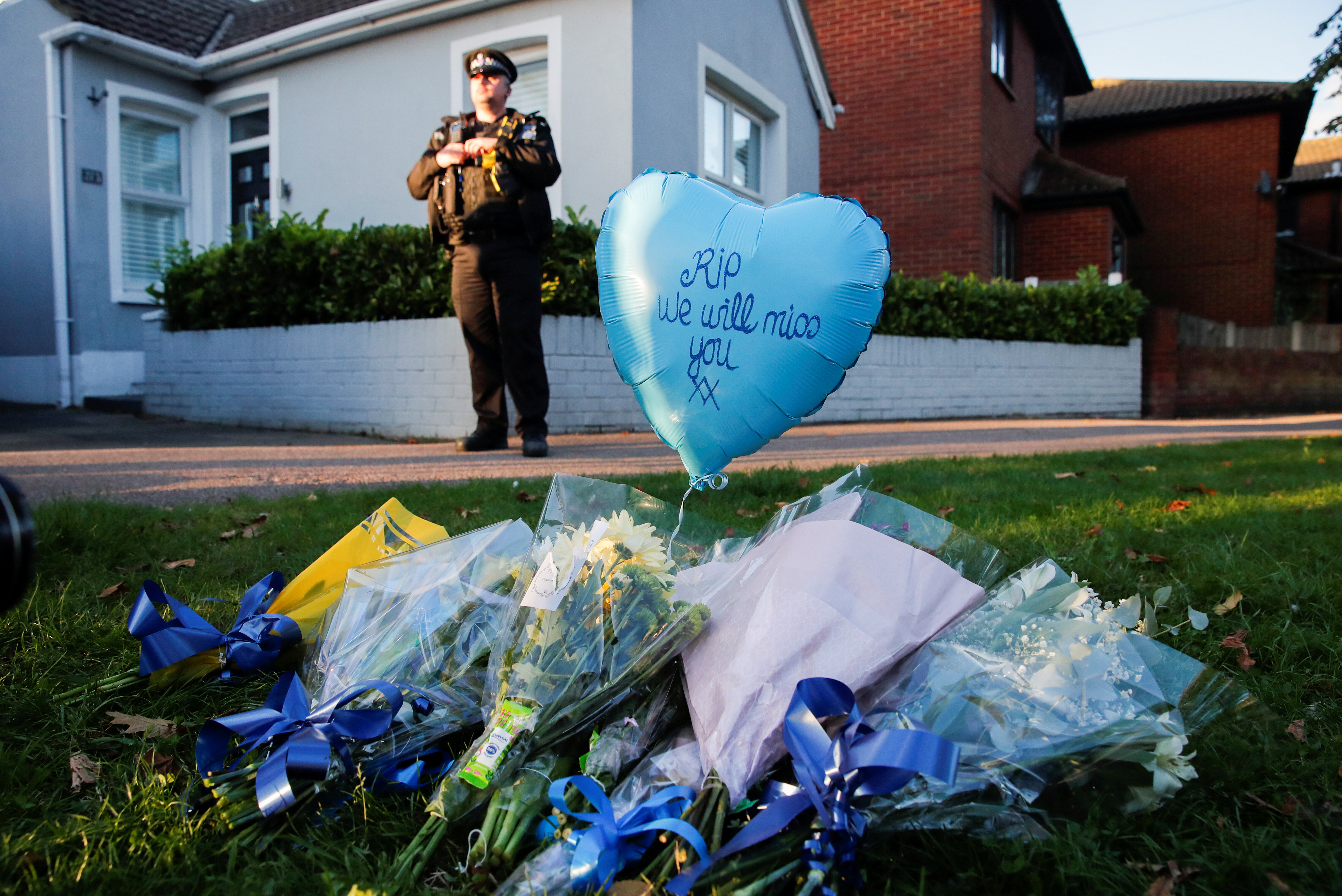 Flowers and a ballon are pictured outside the scene where MP David Amess was stabbed during constituency surgery, in Leigh-on-Sea, Britain October 15, 2021. REUTERS/Andrew Couldridge