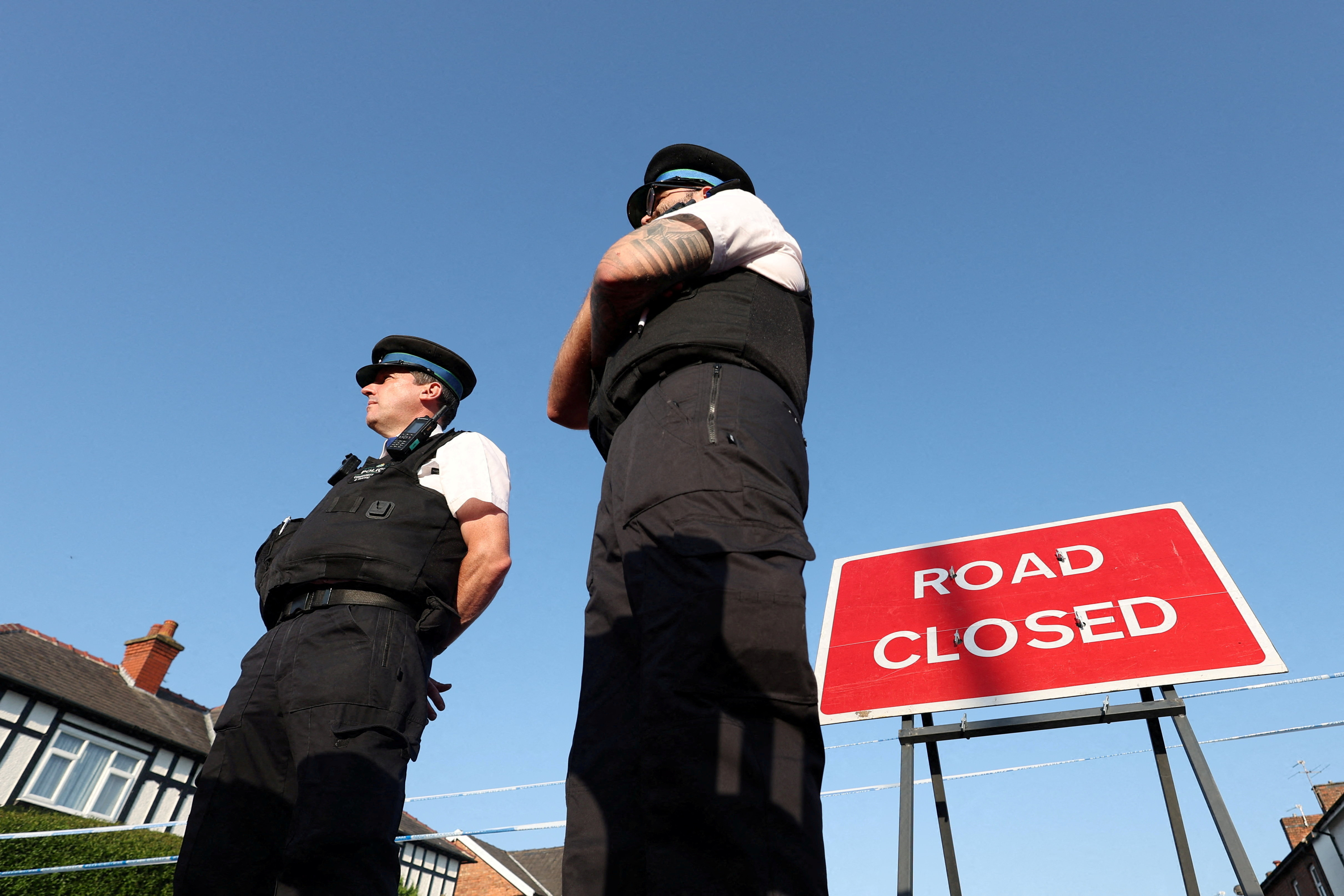 Police officers stand near a 