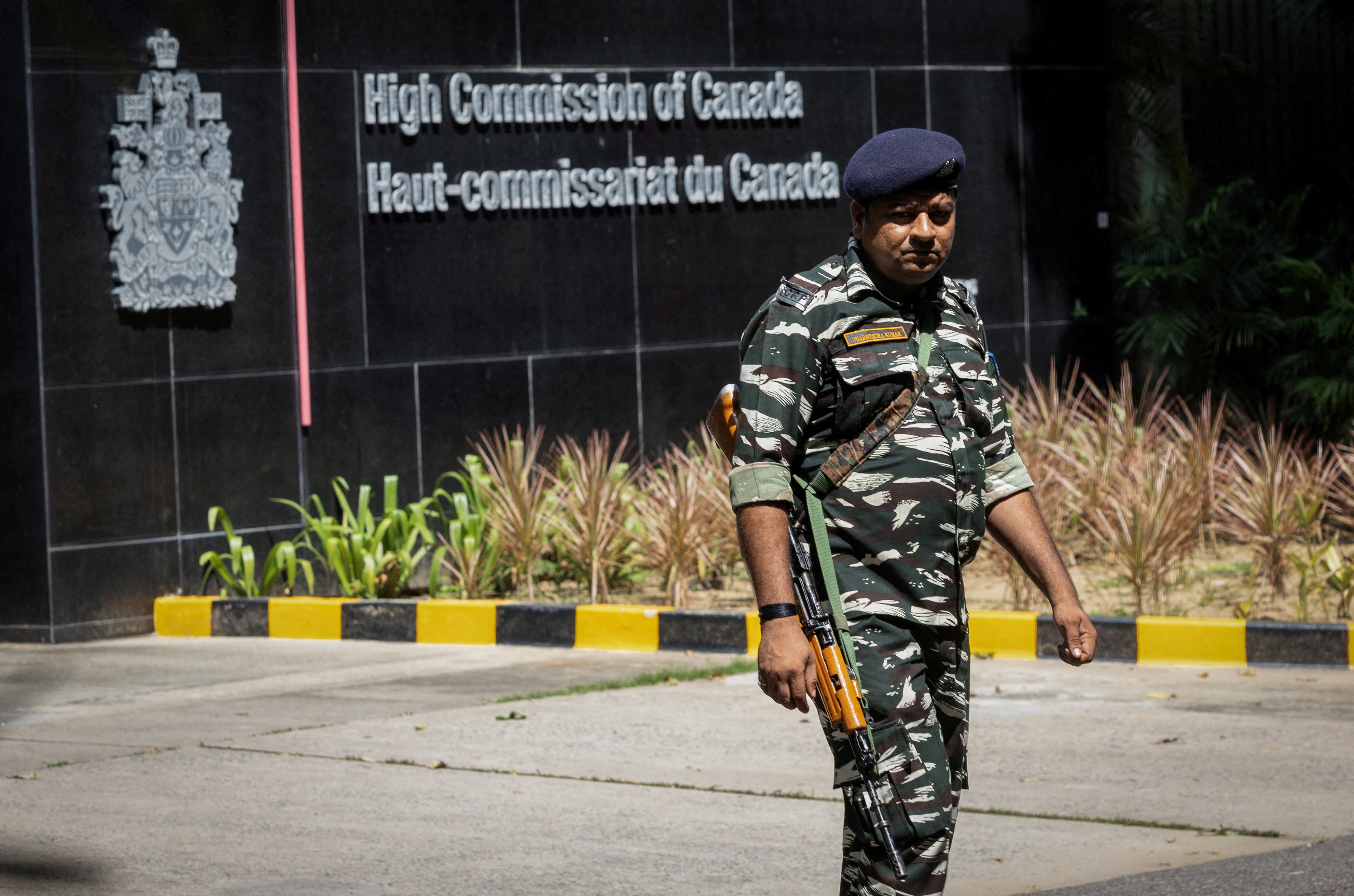 A security personnel stands guard outside the Canadian High-Commision in New Delhi