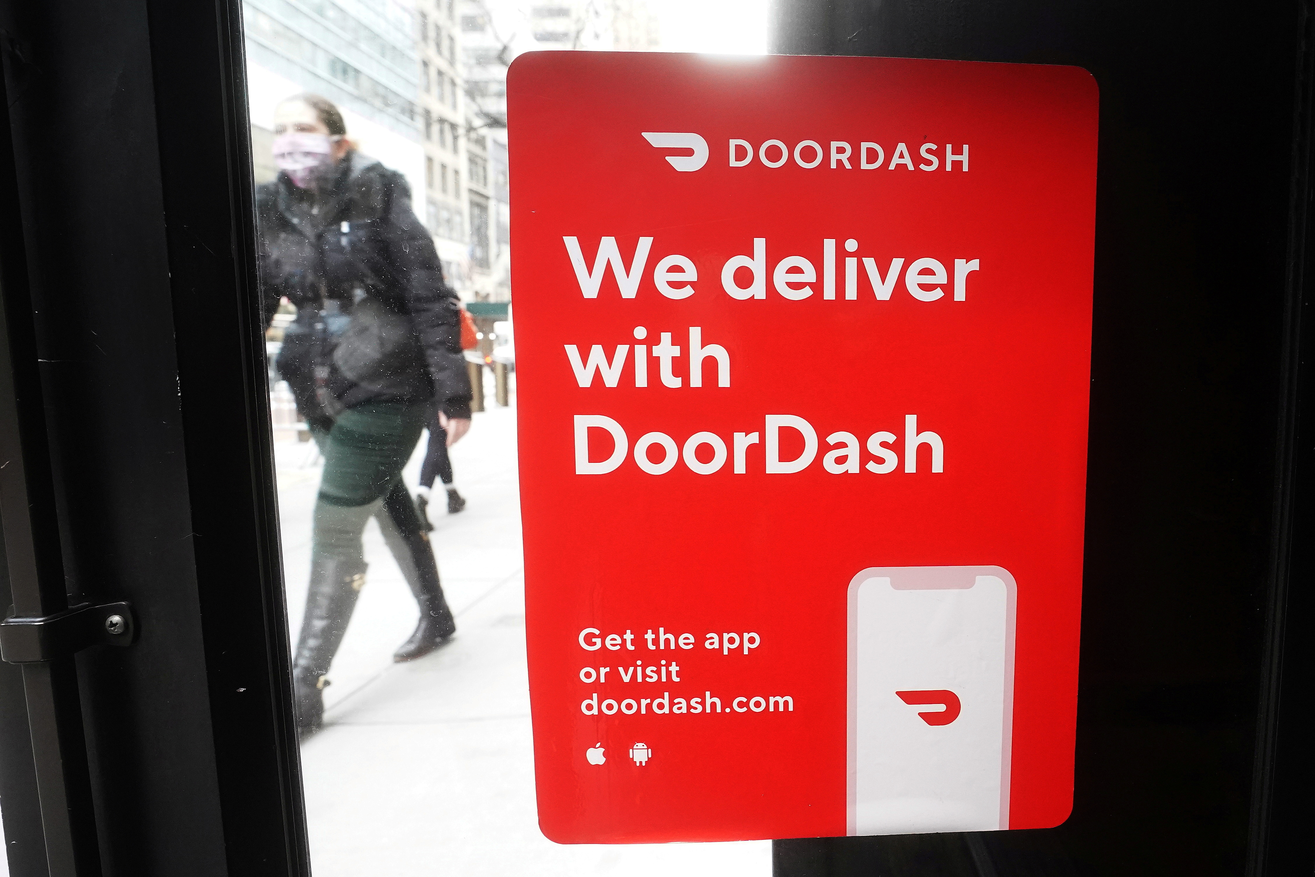 A DoorDash sign is pictured on a restaurant on the day they hold their IPO