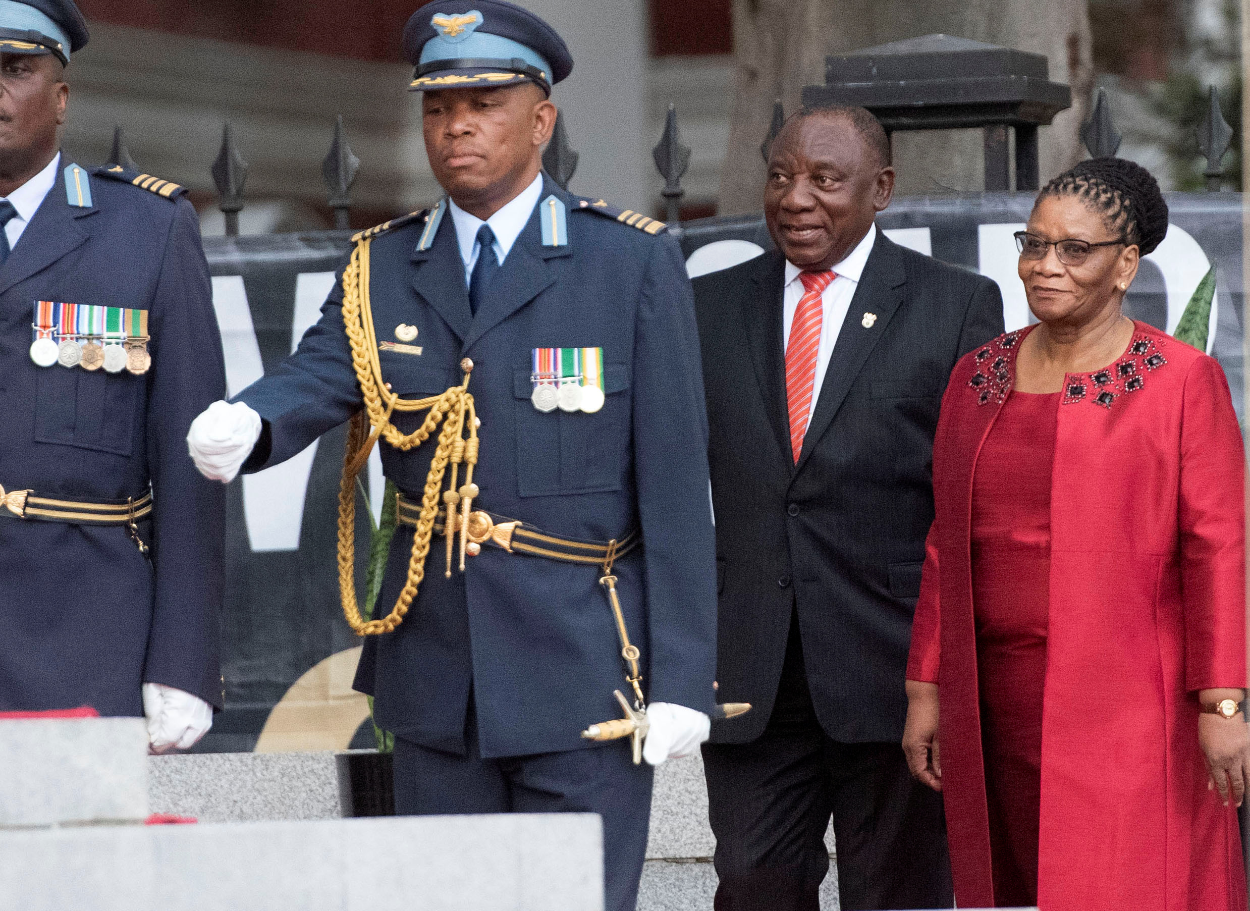 South African President Cyril Ramaphosa arrives with Thandi Modise, former Speaker of the National Assembly, to deliver his State of the Nation address at parliament in Cape Town, South Africa, February 13, 2020. Brenton Geach/Pool via REUTERS