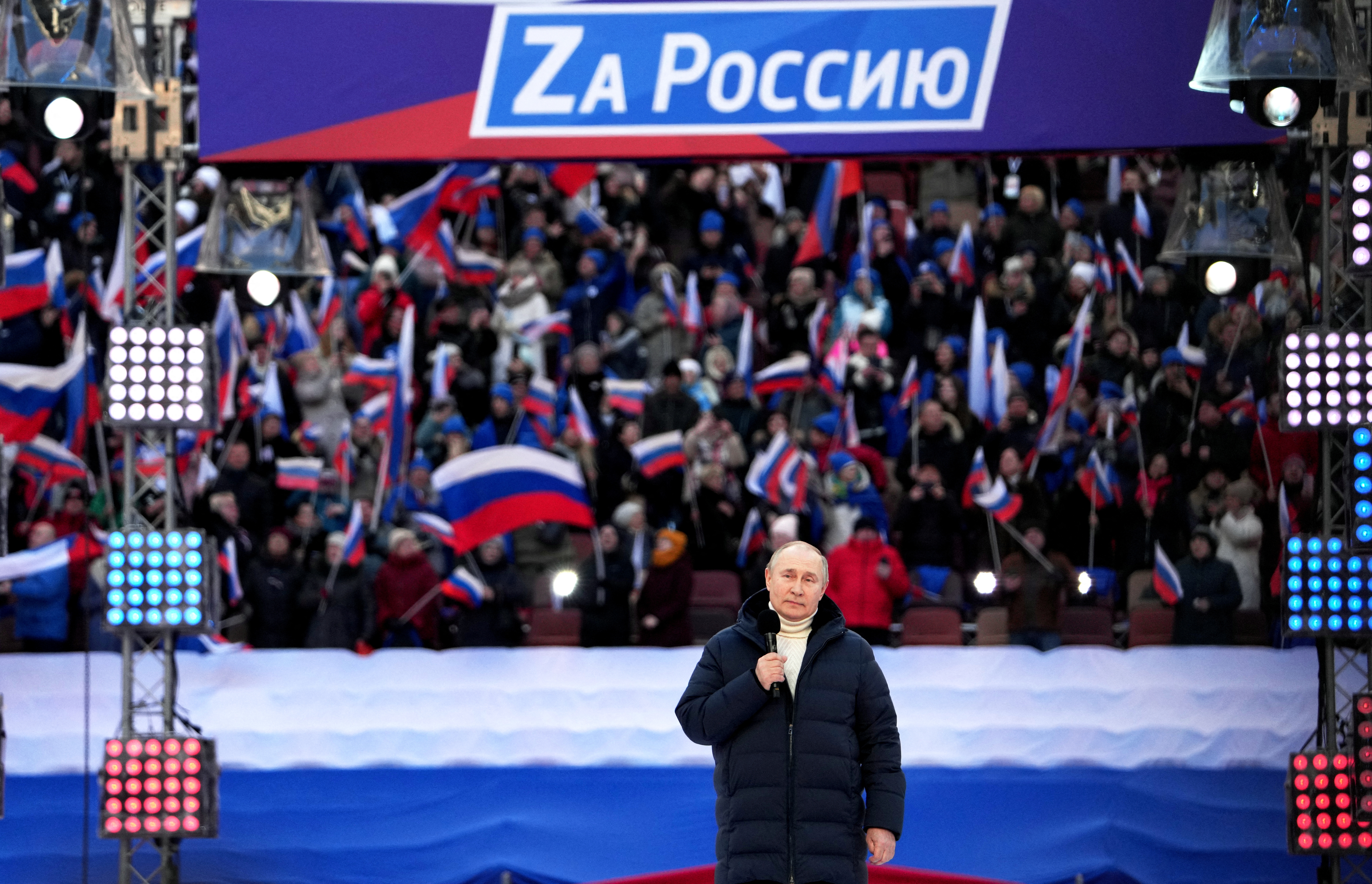 Russian President Vladimir Putin attends a concert marking the eighth anniversary of Russia's annexation of Crimea in Moscow