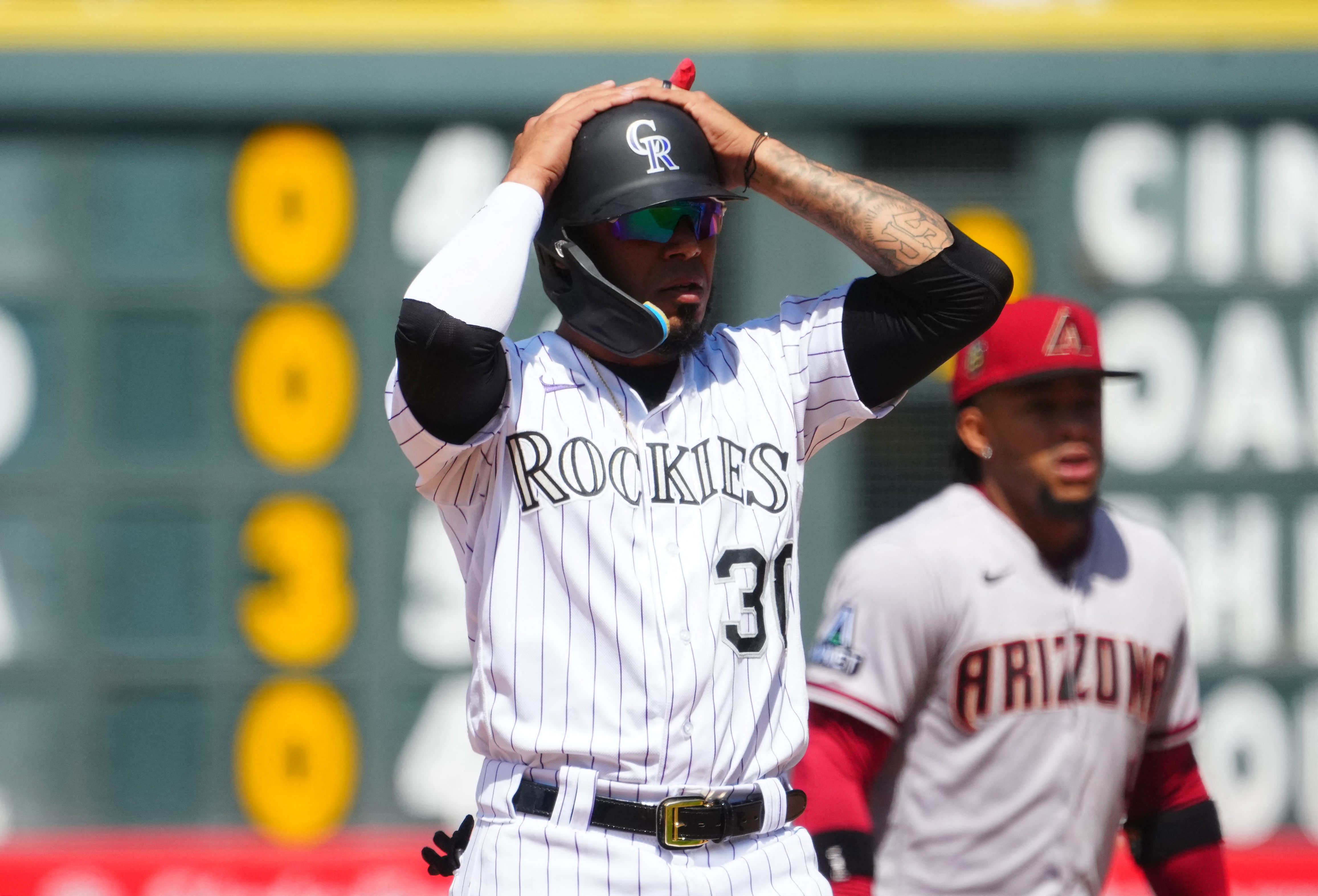 Rockies offense explodes in 12-4 win to avoid sweep