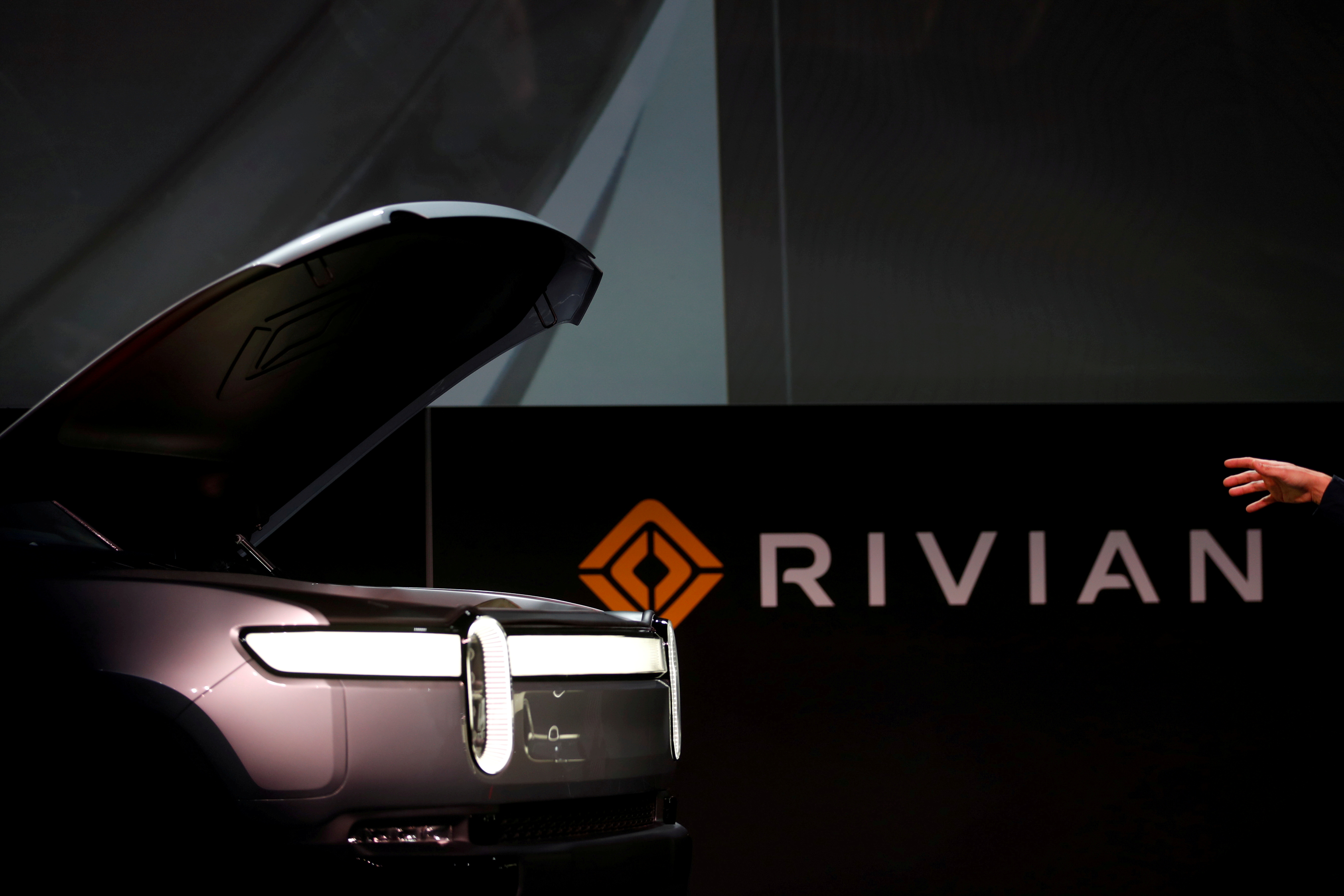 R.J. Scaringe, Rivian's 35-year-old CEO, introduces his company's R1T all-electric pickup truck at Los Angeles Auto Show in Los Angeles, California, U.S. November 27, 2018. REUTERS/Mike Blake/File Photo