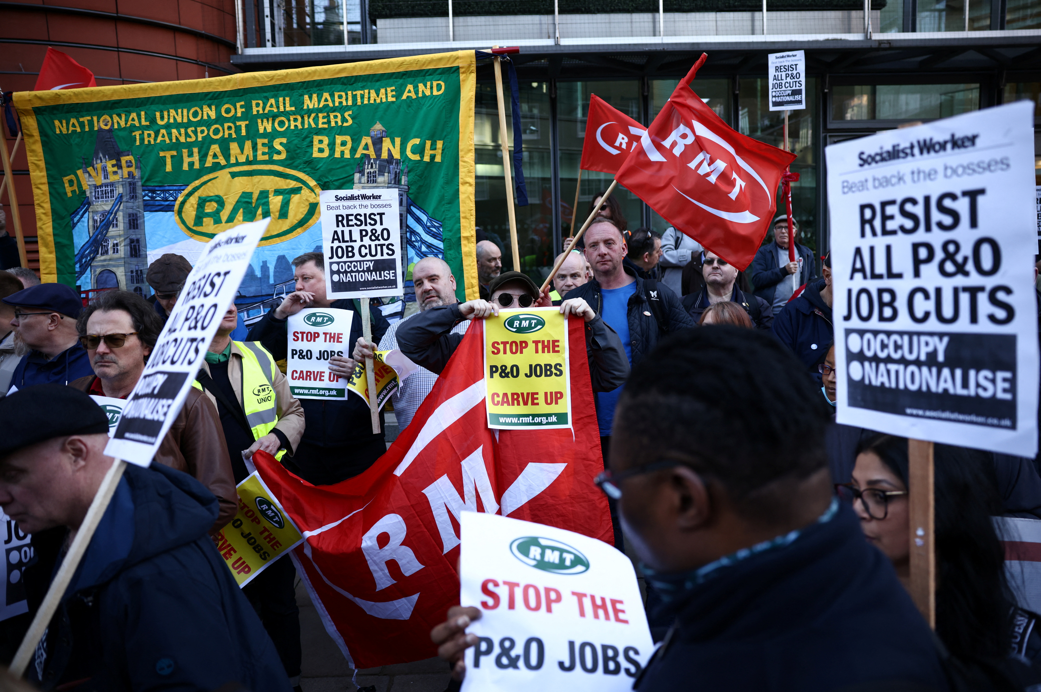 People protest outside the offices of DP World, who own P&O Ferries, after the company fired hundreds of employees, in London