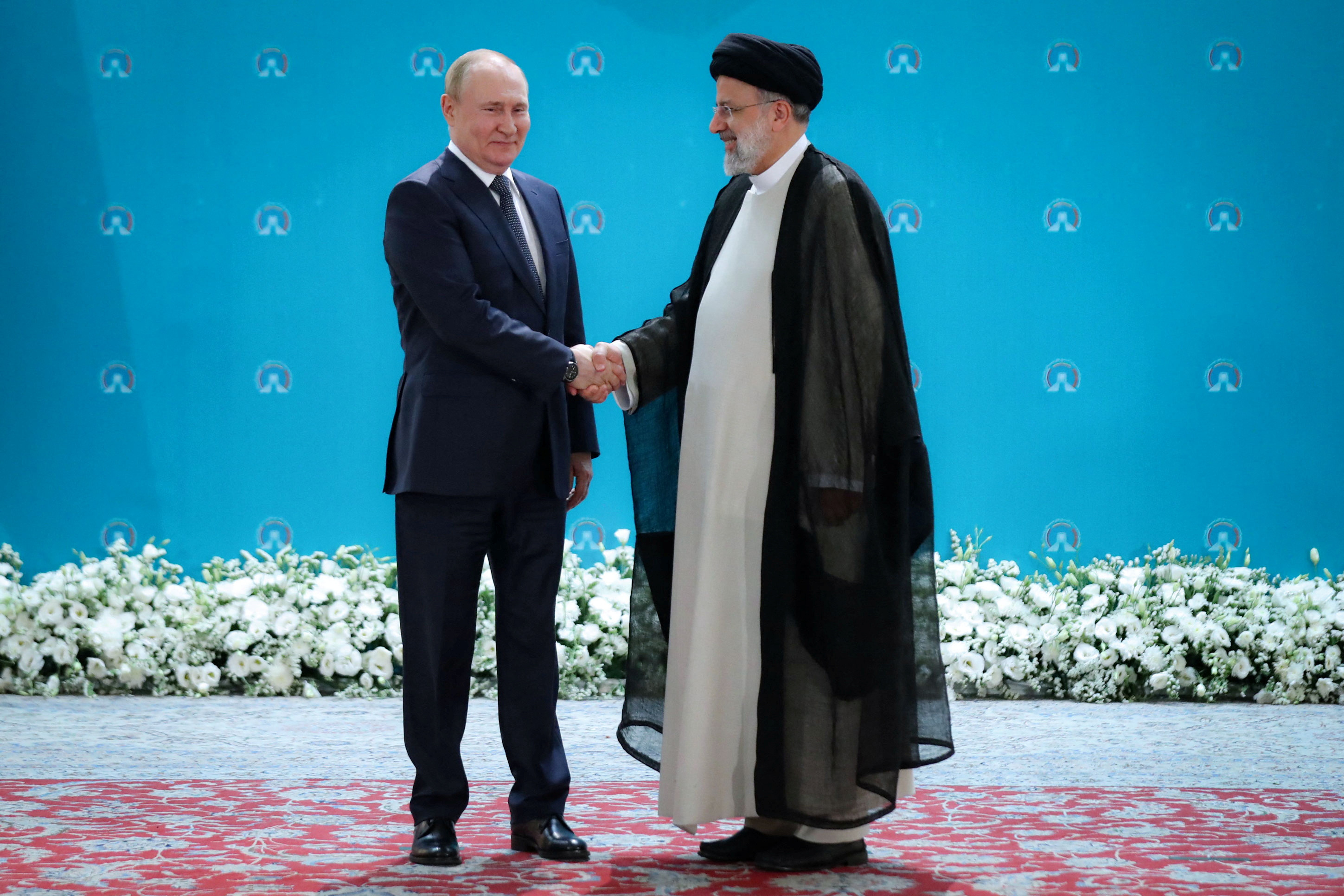 Russian President Vladimir Putin and Iranian President Ebrahim Raisi meet before a summit of leaders from the guarantor states of the Astana process, designed to find a peace settlement in the Syrian conflict, in Tehran