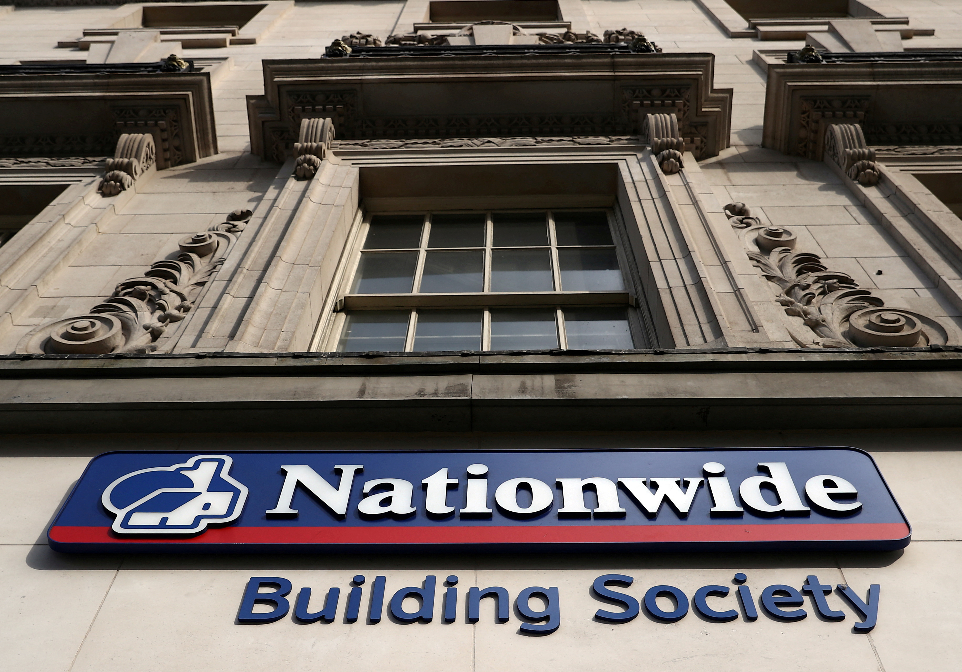Signage is seen outside of a Nationwide Building Society in London