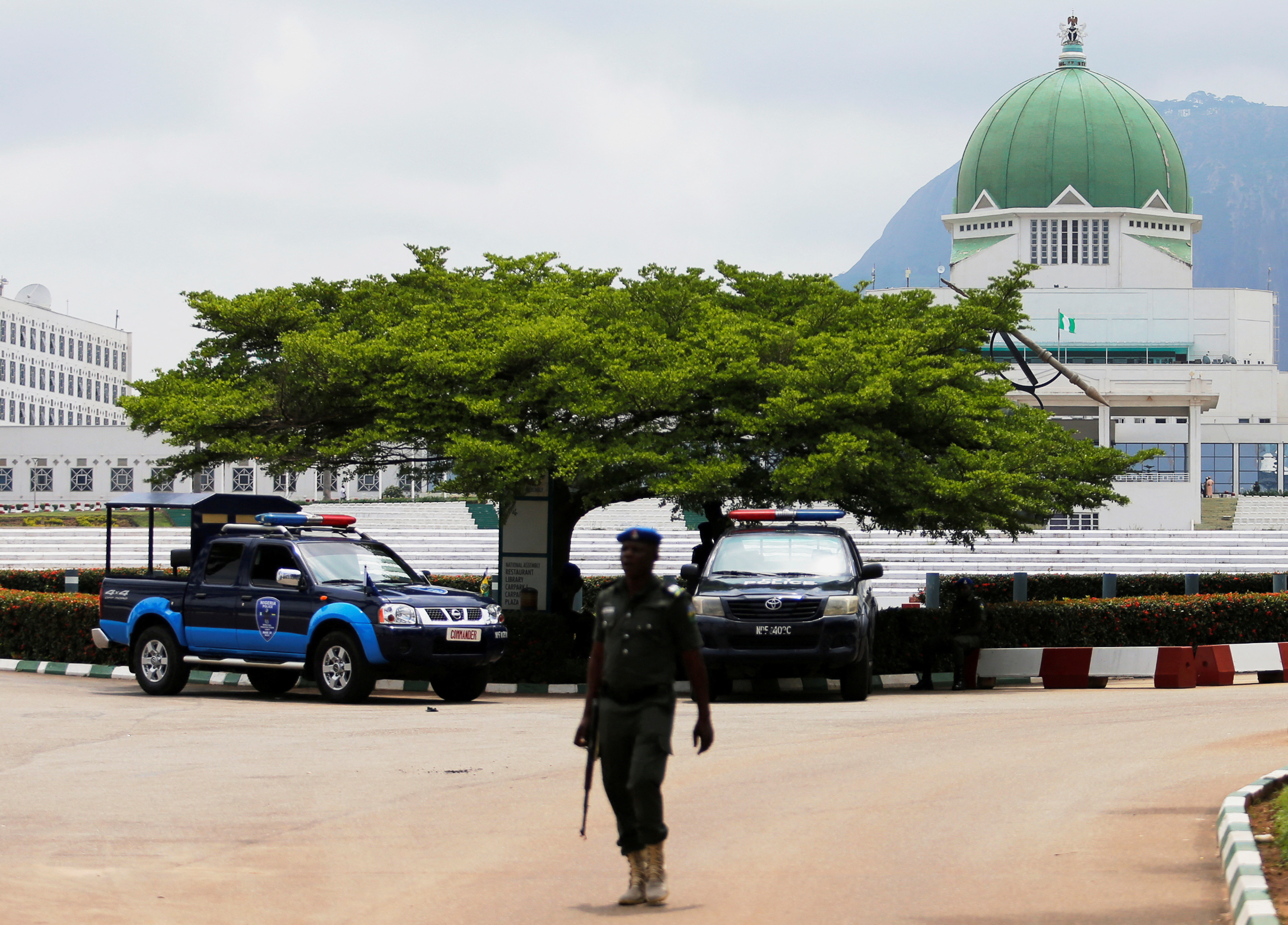 A policeman walks outside the National Assembly in Abuja