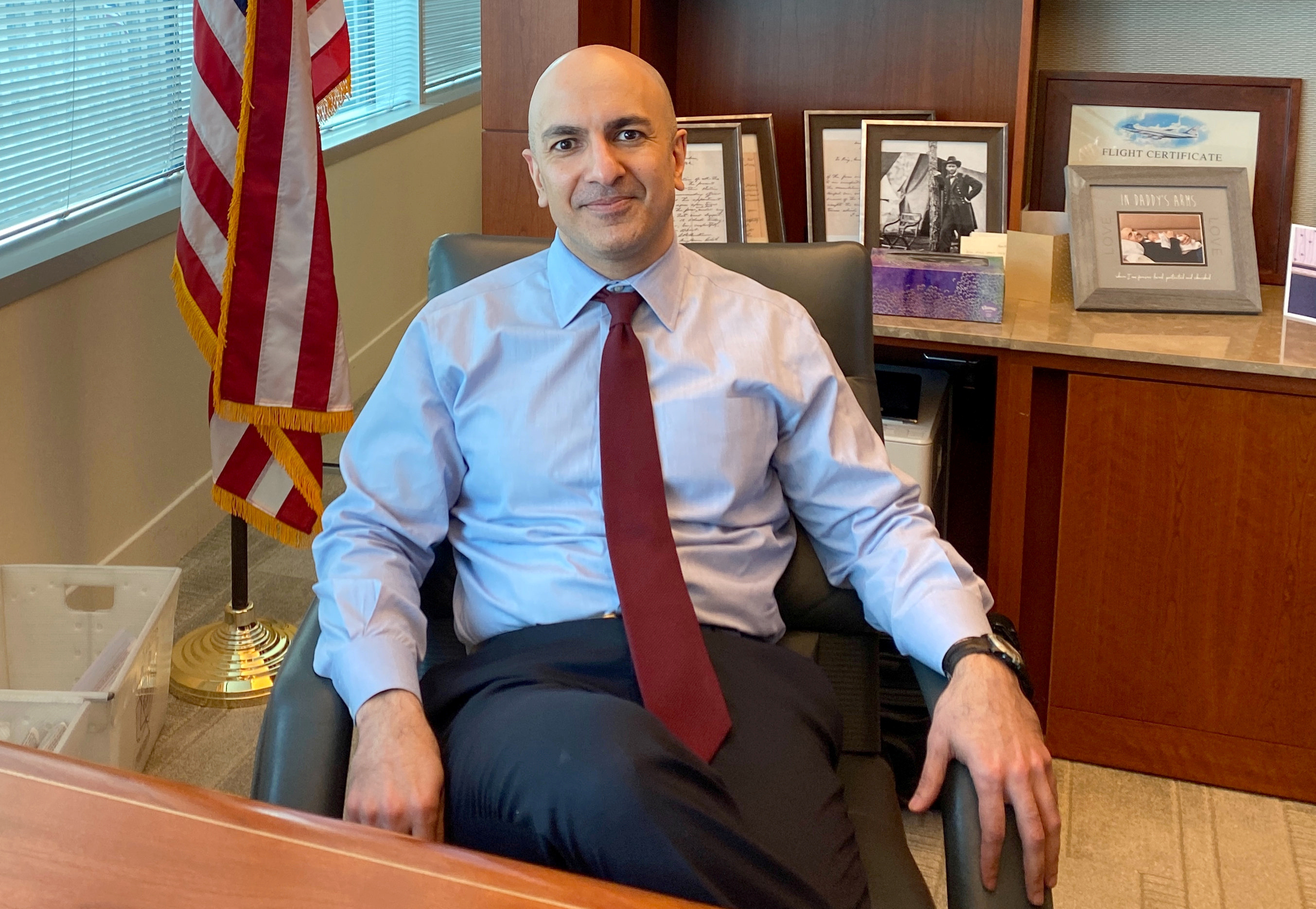 Minneapolis Federal Reserve Bank President Neel Kashkari poses during an interview with Reuters in his office at the bank's headquarters in Minneapolis