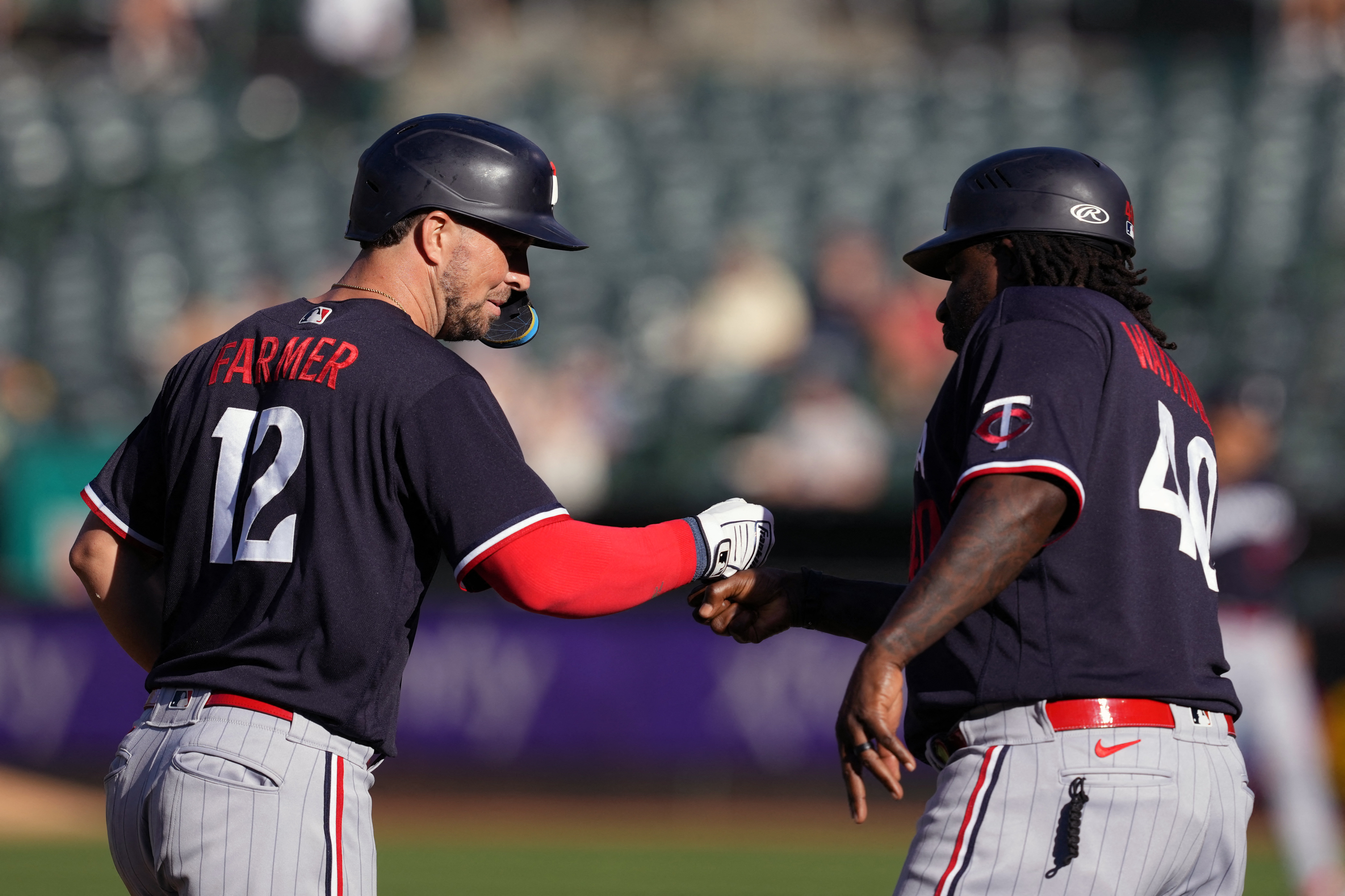 Minnesota Twins' Kyle Farmer (12) tosses his bat after striking