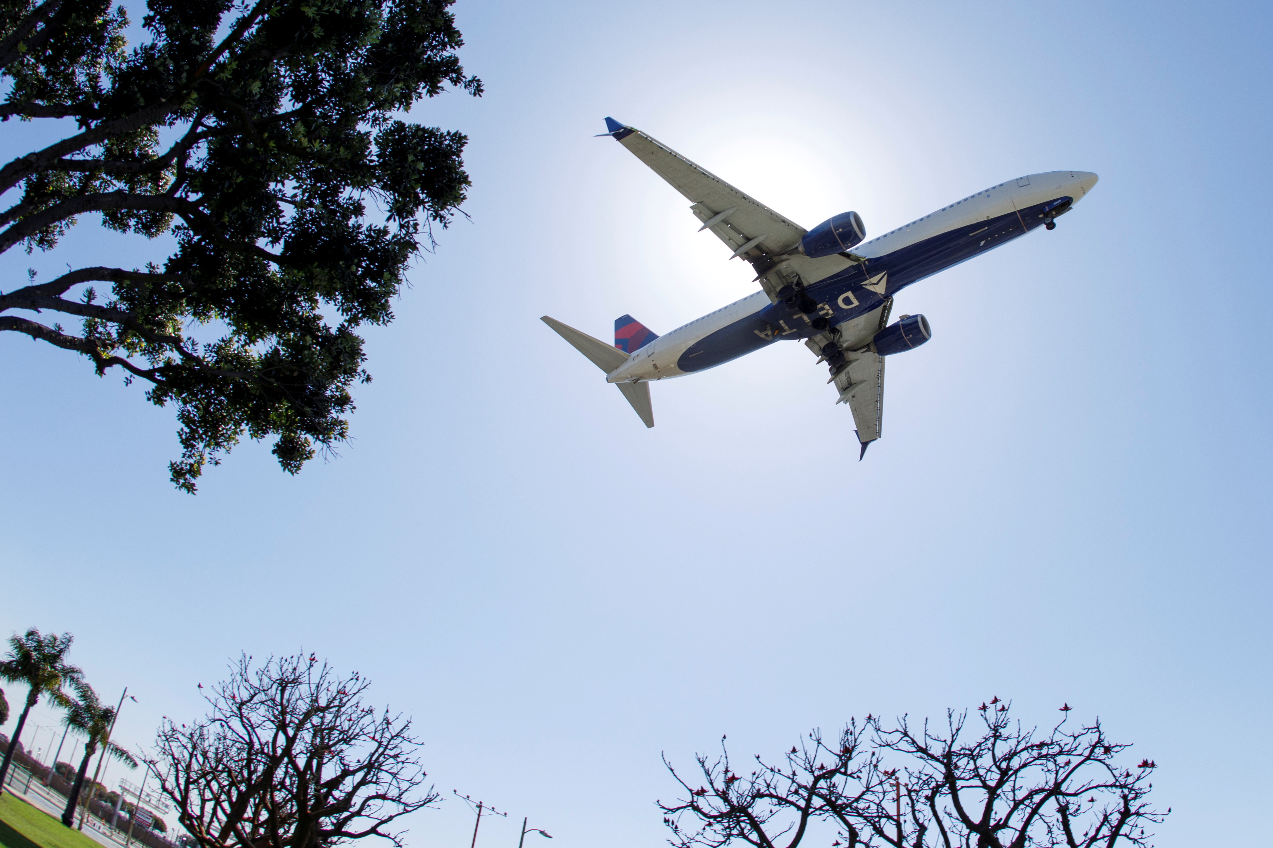 A Delta Airlines passenger jet approaches to land at LAX in Los Angeles