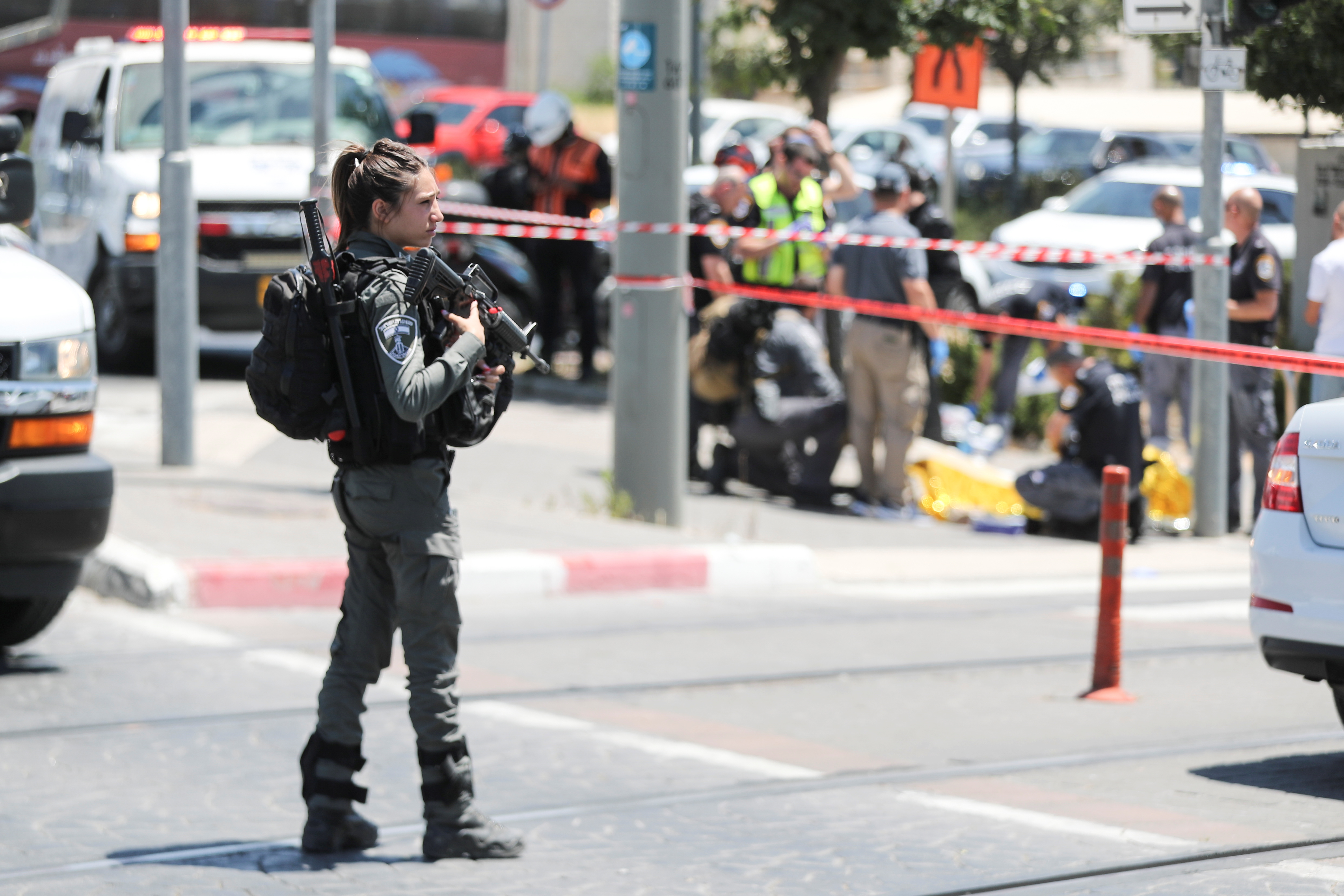 An Israeli security force member stands guard at the scene of an incident in Jerusalem