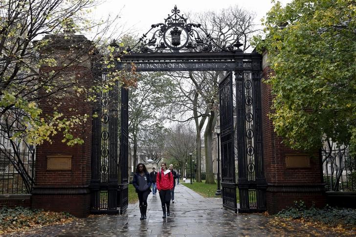 Students walk on the campus of Yale University in New Haven, Connecticut
