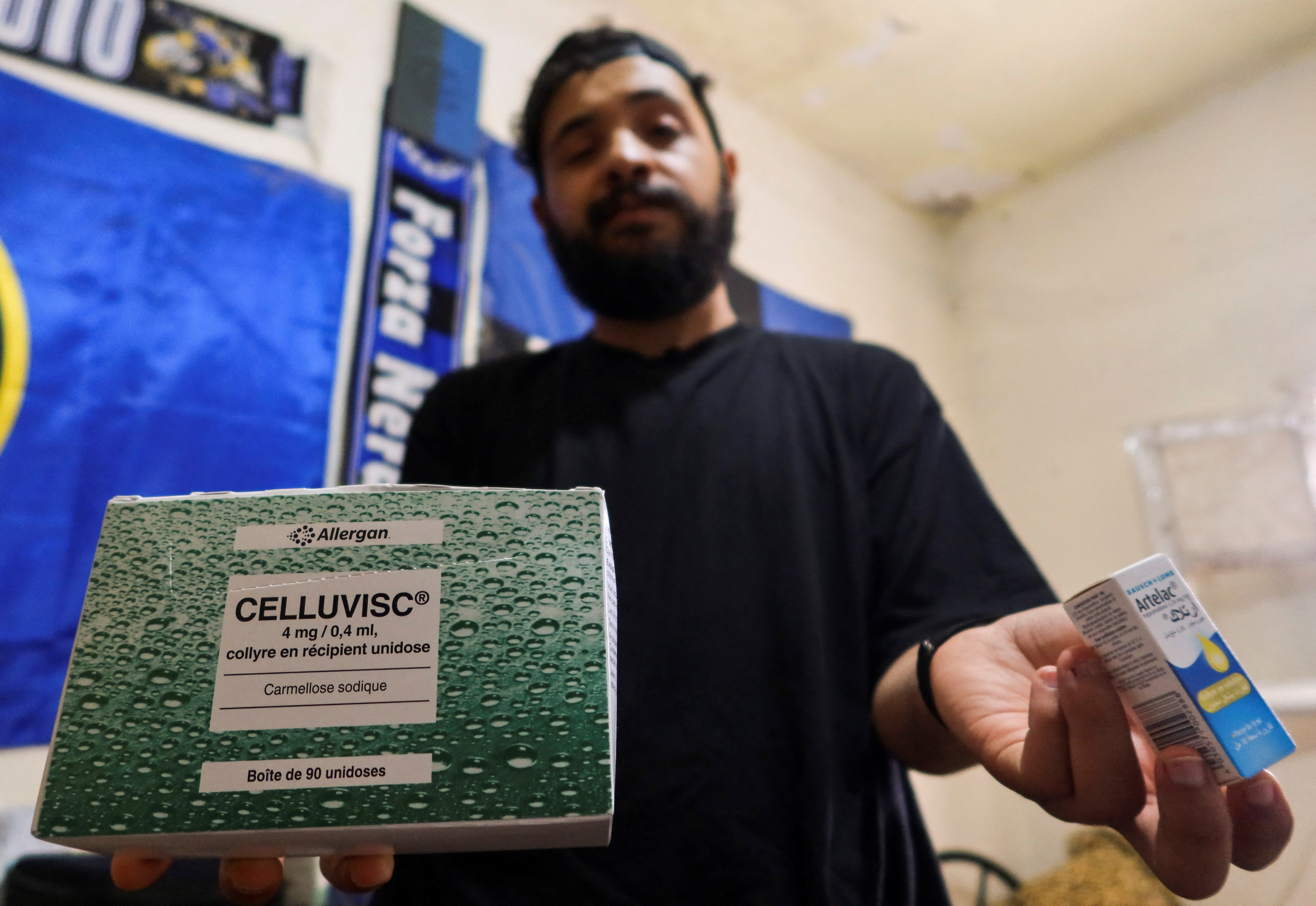 Abdessalem Maraouni, a Tunisian university student displays a medicine box of "Celluvisc" at his home in Tunis