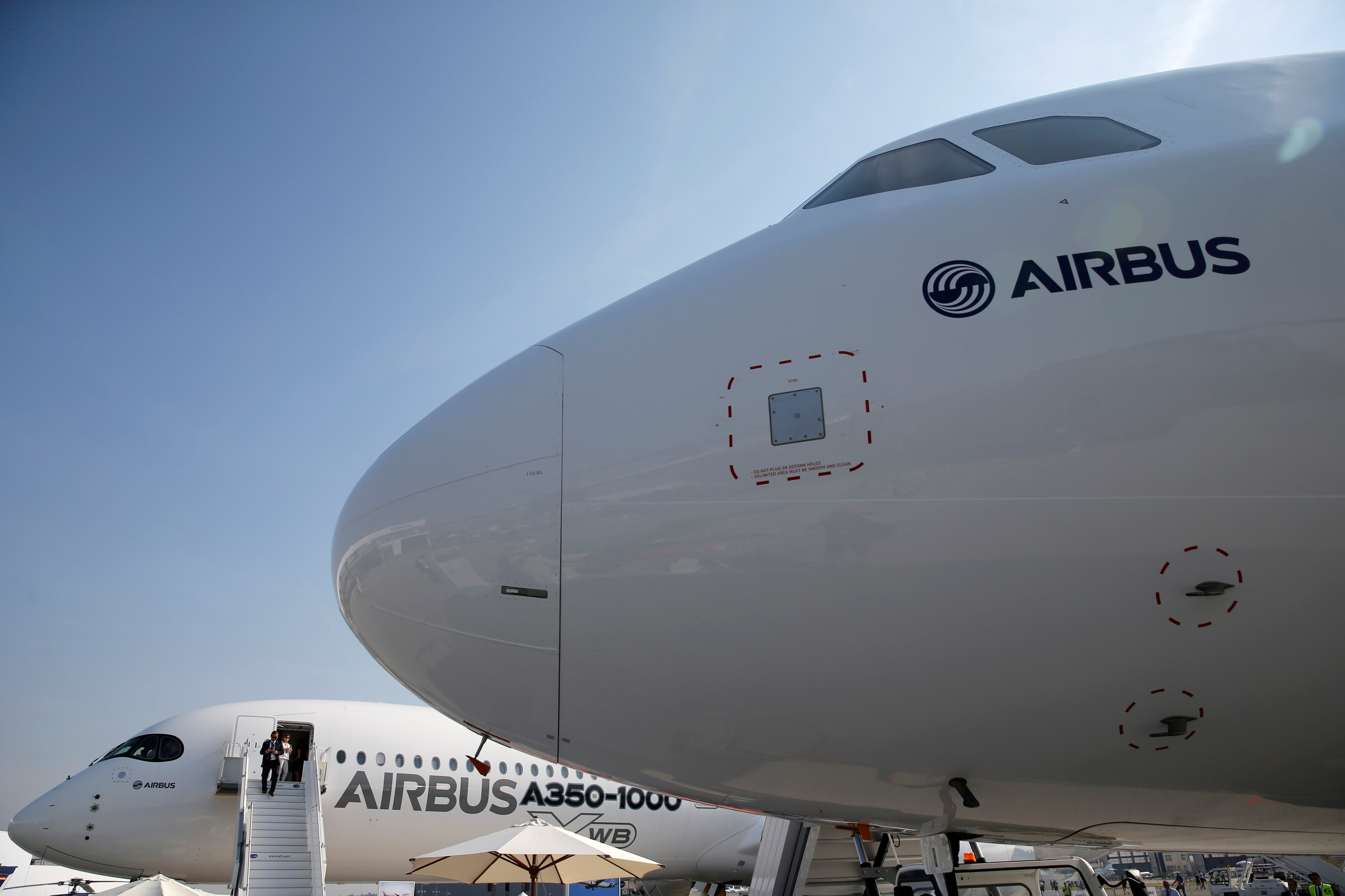 An Airbus A350-1000 Xwb and an Airbus A321neo are seen on static display during the 52nd Paris Air Show at Le Bourget Airport near Paris
