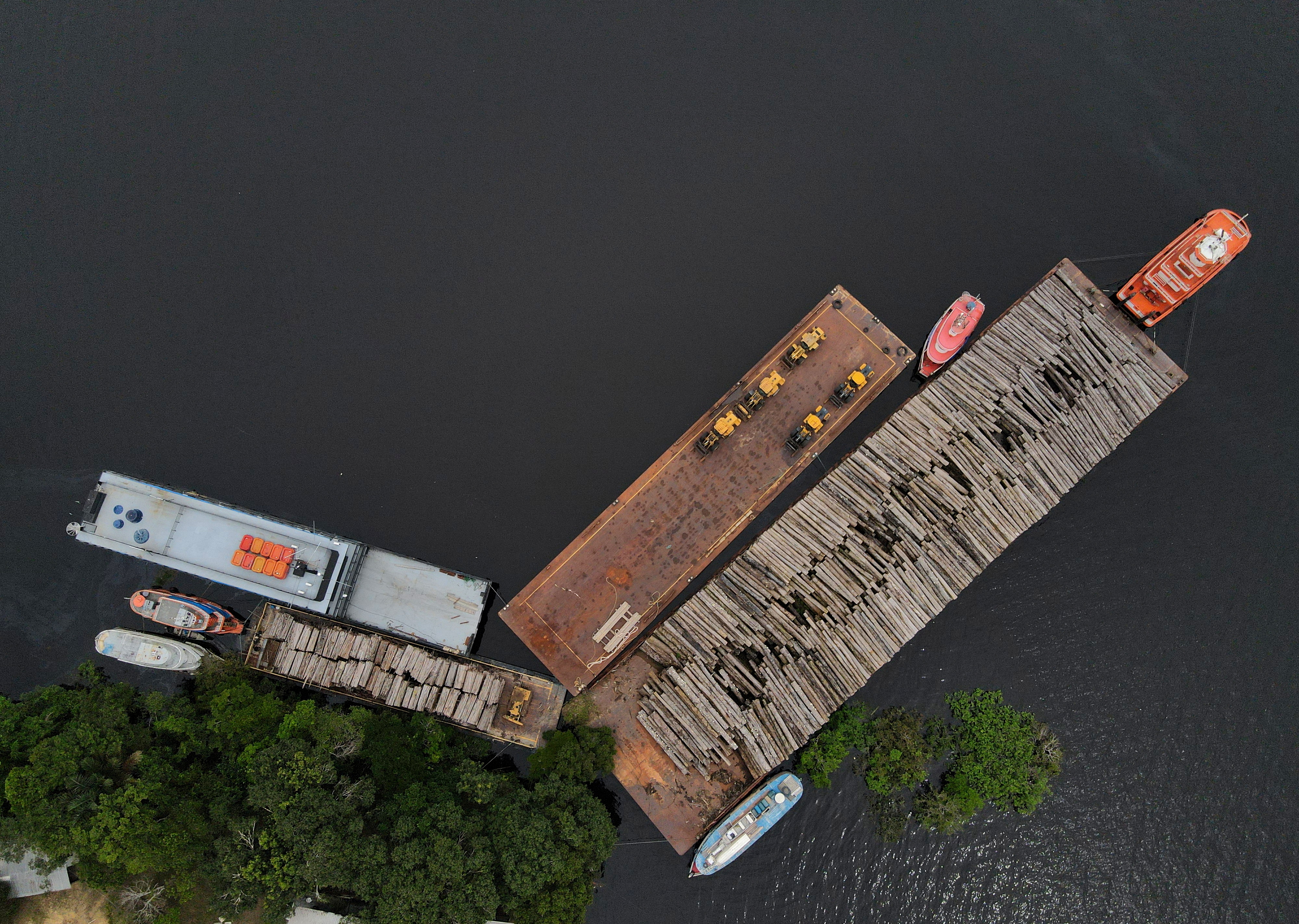 An aerial view shows wood logs on a raft at the Federal Police base in Manaus