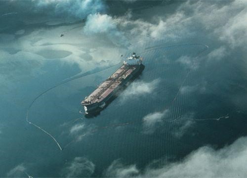Containment booms surround the oil tanker Exxon Valdez after it ran aground in Prince William Sound, Alaska