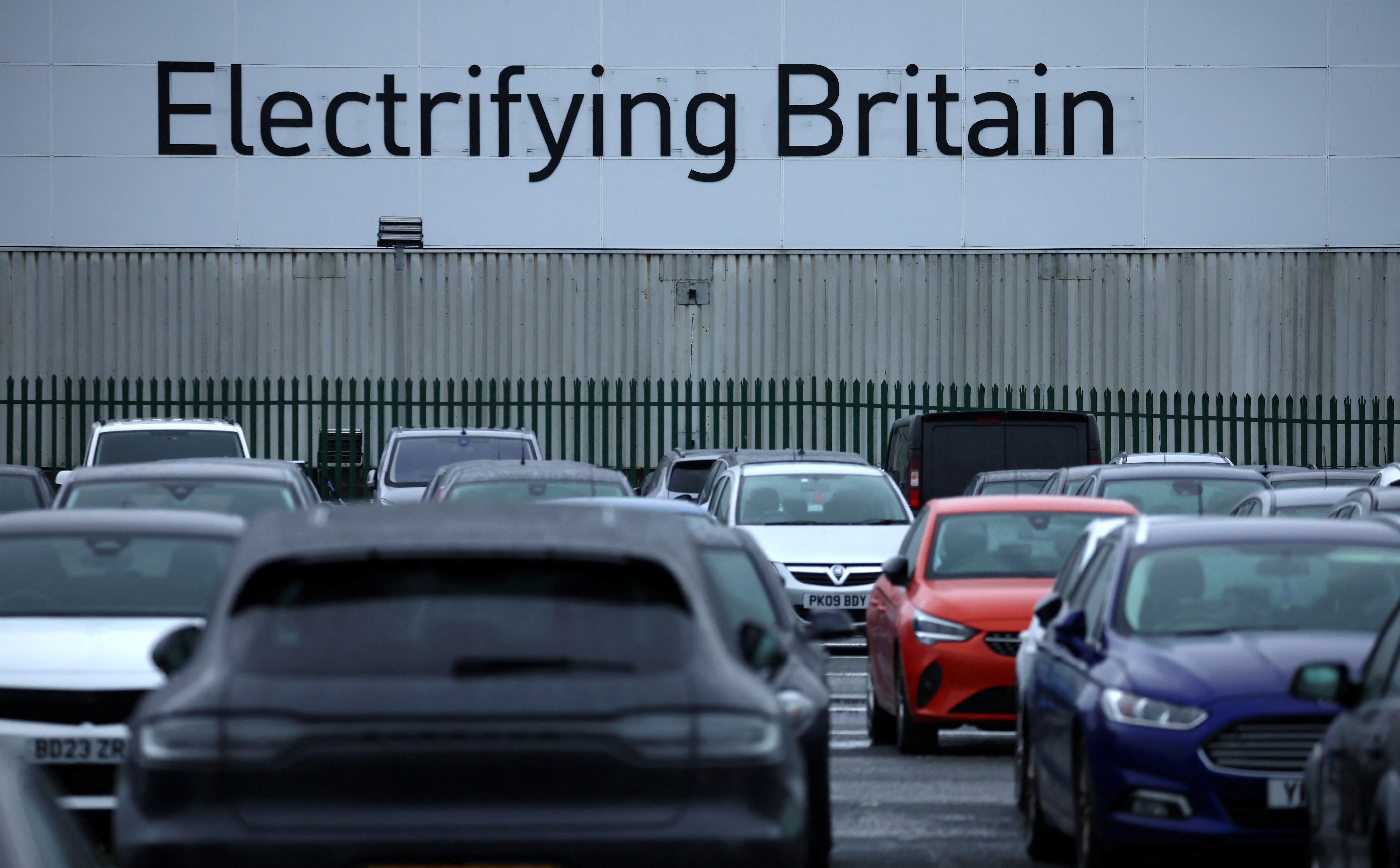 Signage saying ‘Electrifying Britain’ is seen on the outside of the Stellantis owned Vauxhall car factory in Ellesmere Port, Britain