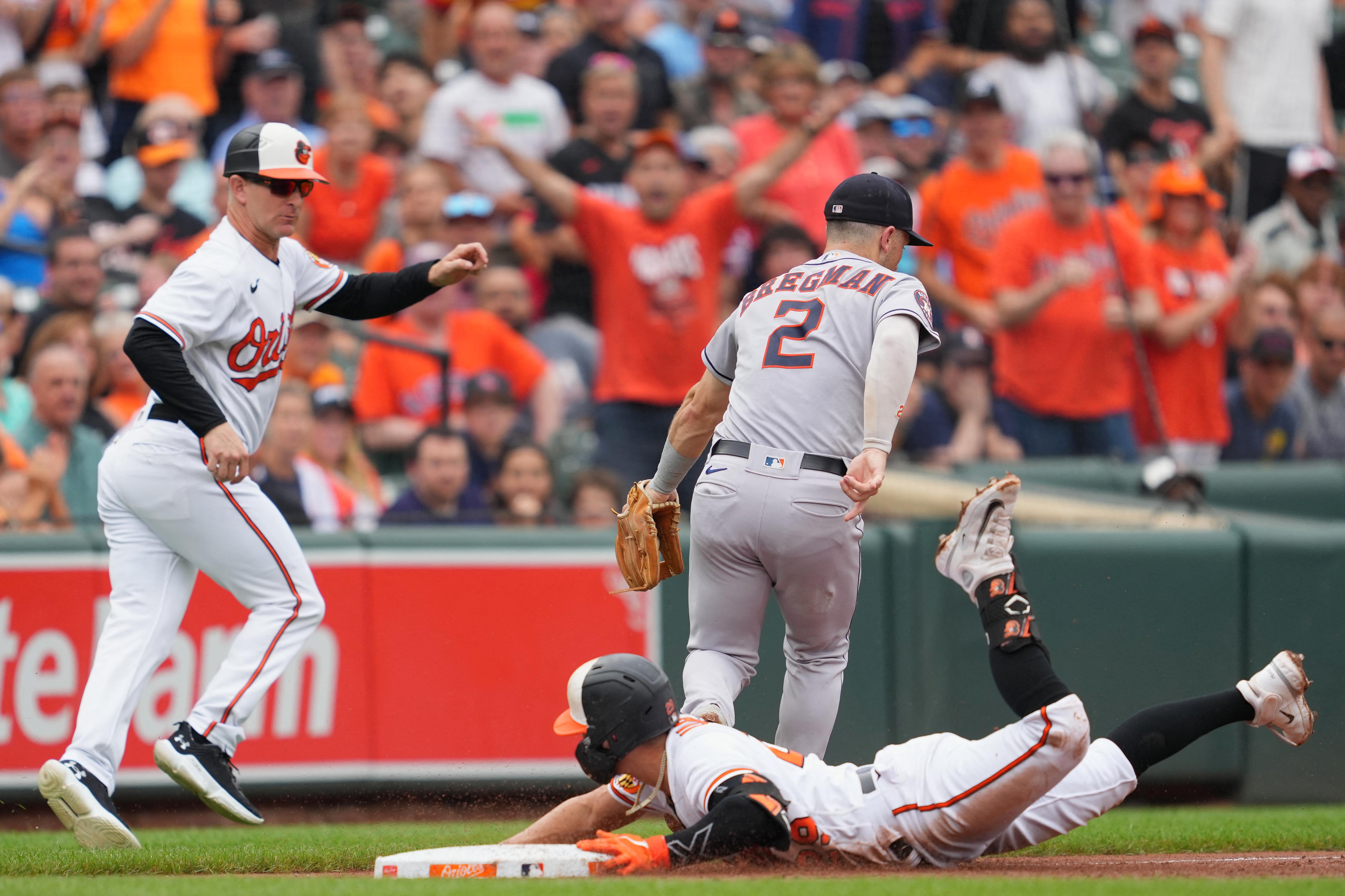 Baltimore Orioles pitcher Dean Kremer, right, is congratulated by catcher  Adley Rutschman after pitching a 6-0 shutout against the Houston Astros in  a baseball game, Friday, Sept. 23, 2022, in Baltimore. (AP