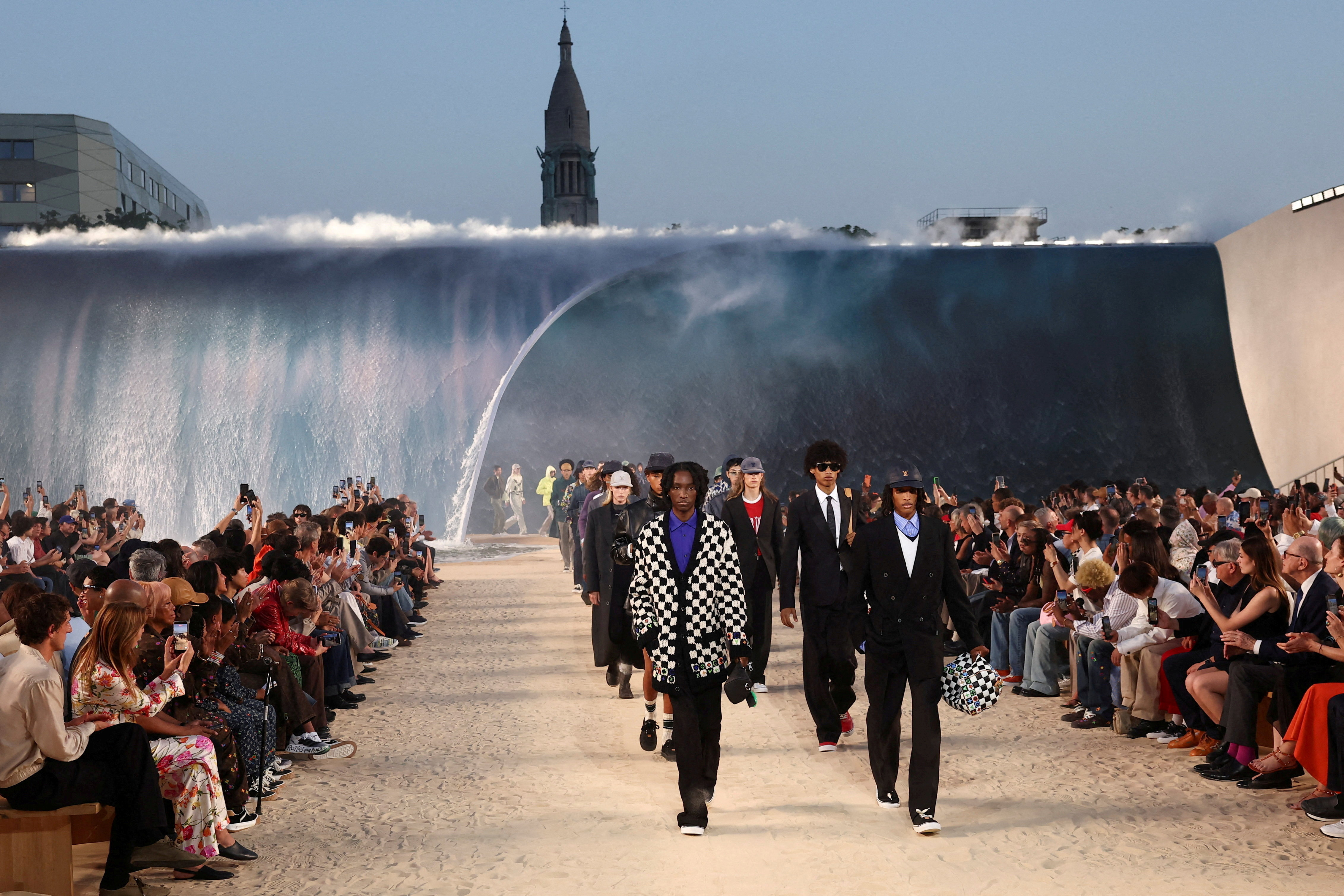 In sweltering Paris, Louis Vuitton's waterfall show draws scrutiny
