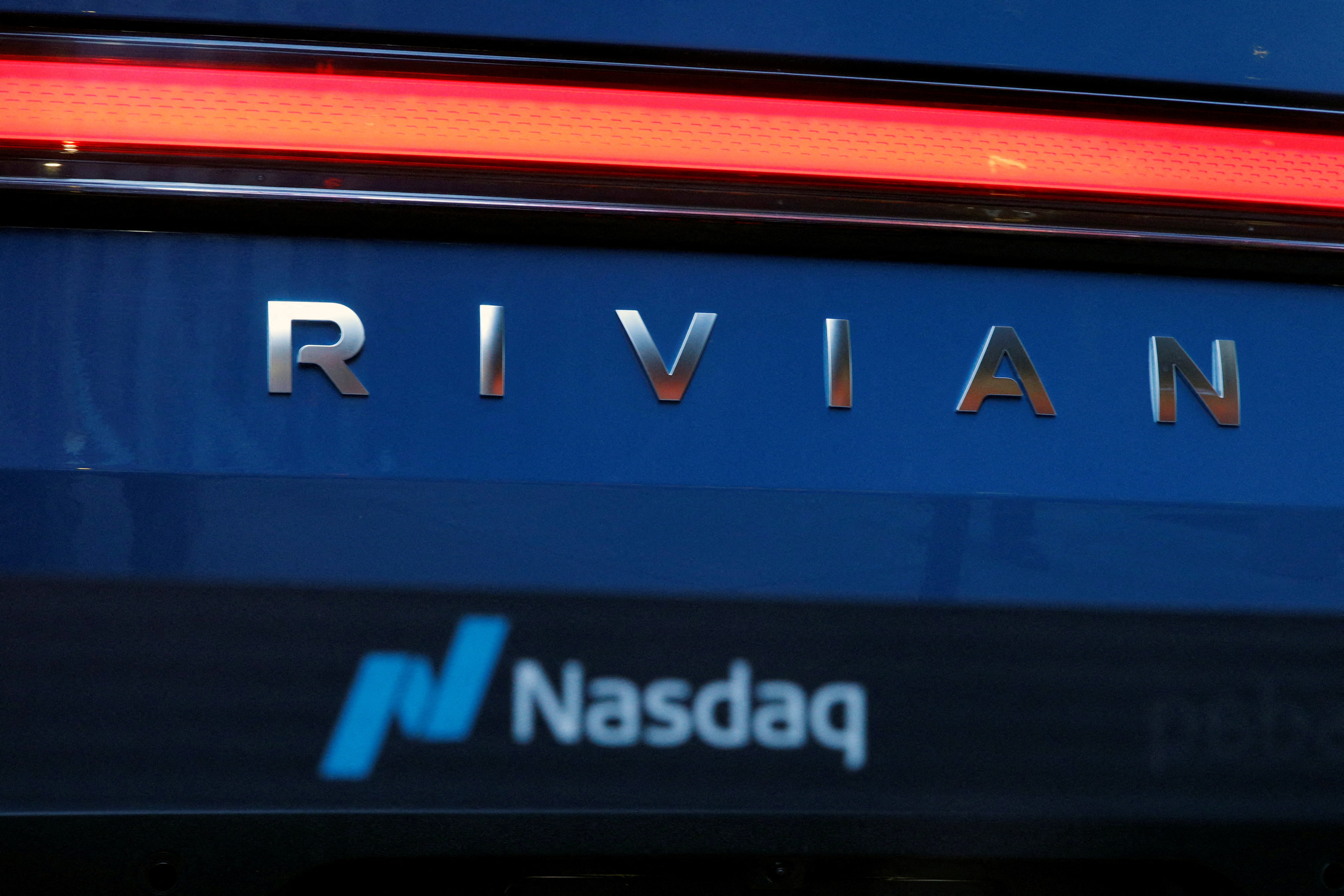 A Rivian R1T pickup, the Amazon-backed electric vehicle (EV) maker, is parked outside the Nasdaq Market site in Times Square in New York