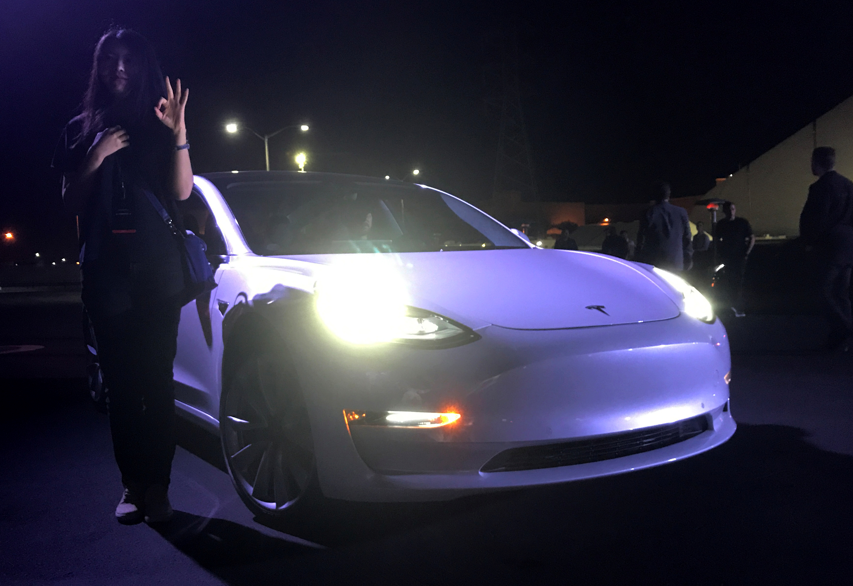 Customer employees receive some of the first Model 3 cars off the Fremont factory's production line during an event at the company's facilities in Fremont