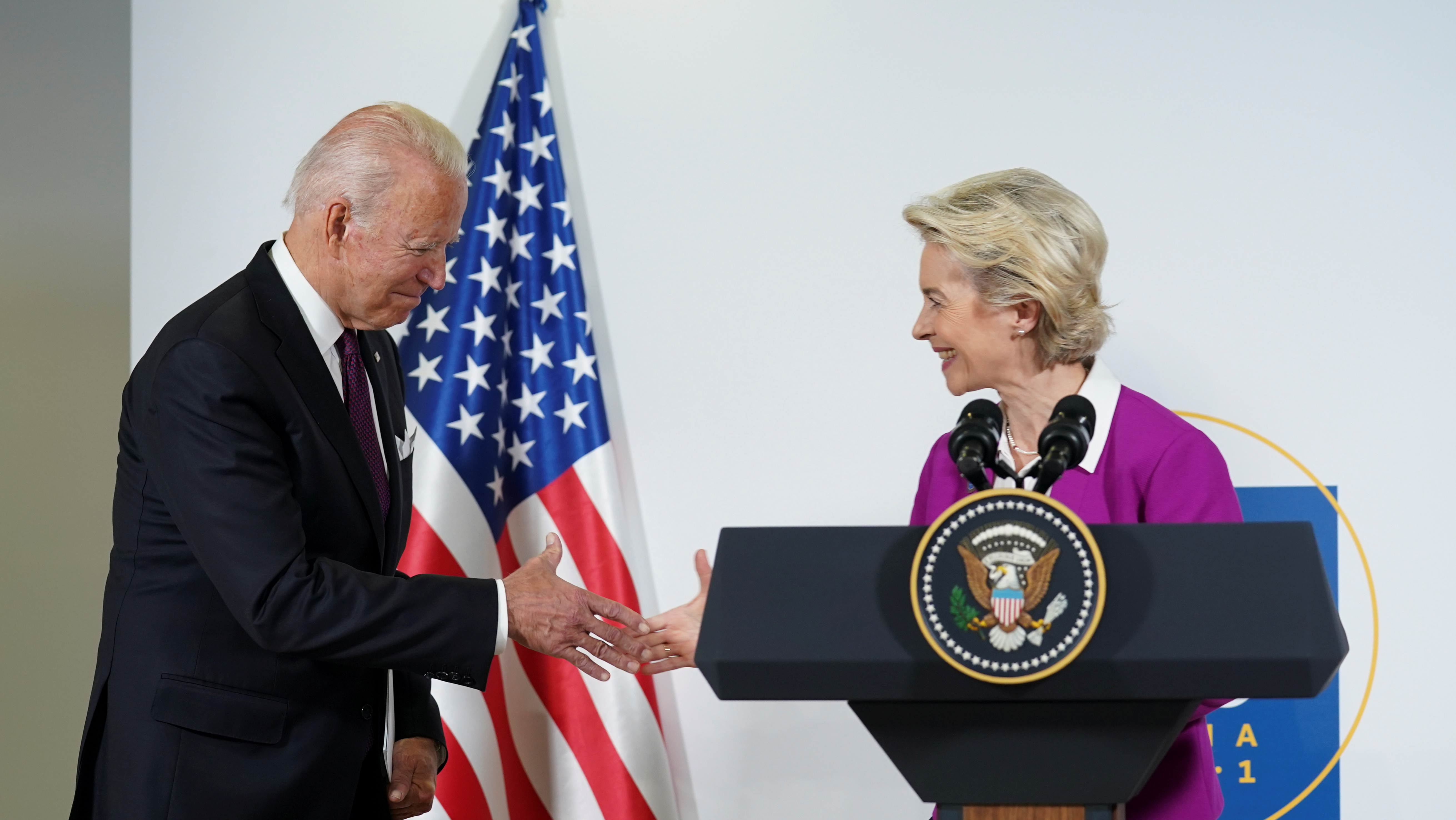 U.S. President Joe Biden and European Commission's President Ursula von der Leyen shake hands after speaking about steel and aluminium tariffs, on the sidelines of the G20 leaders' summit in Rome, Italy October 31, 2021. REUTERS/Kevin Lamarque