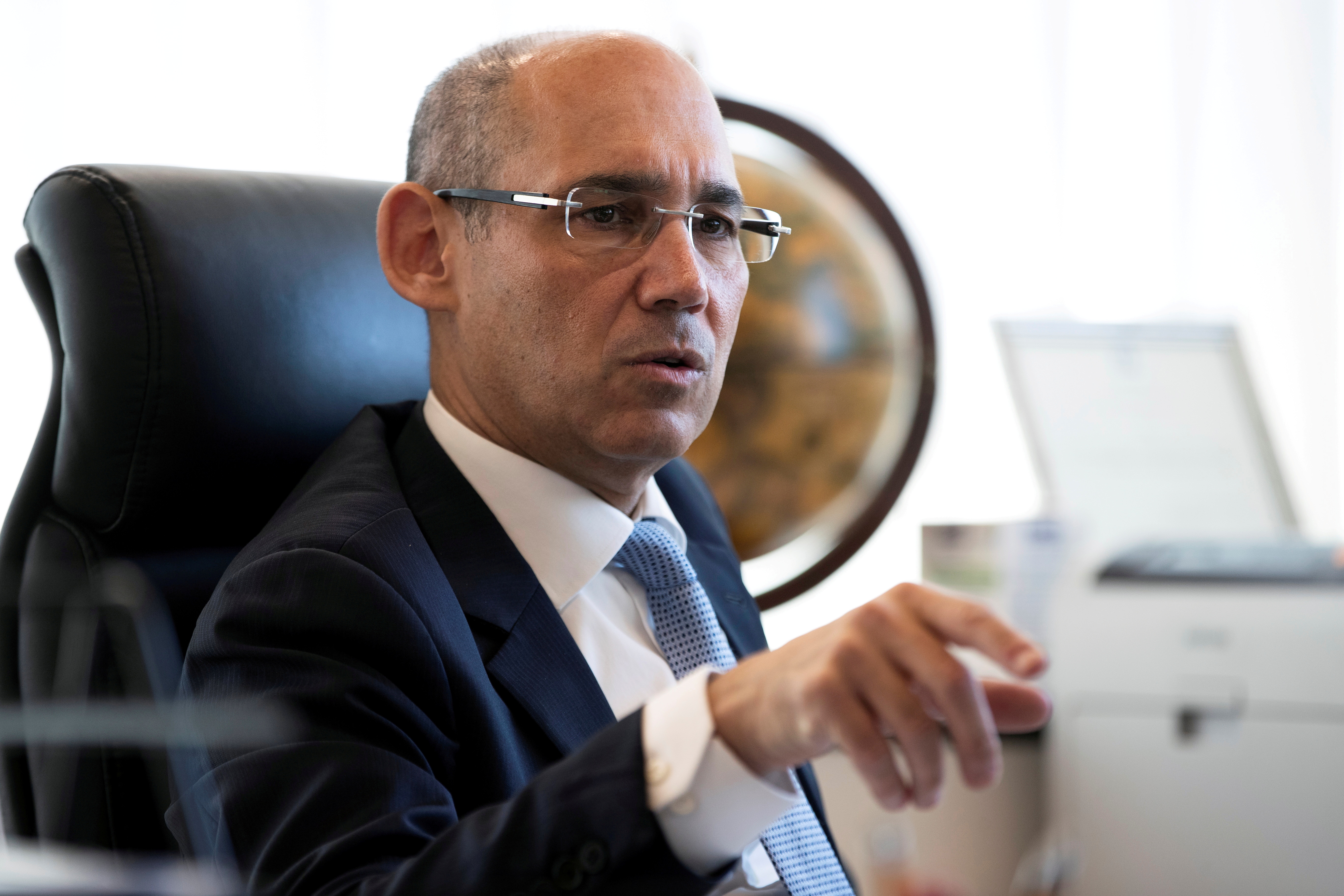 Bank of Israel Governor Amir Yaron gestures while he speaks during his interview with Reuters in Jerusalem