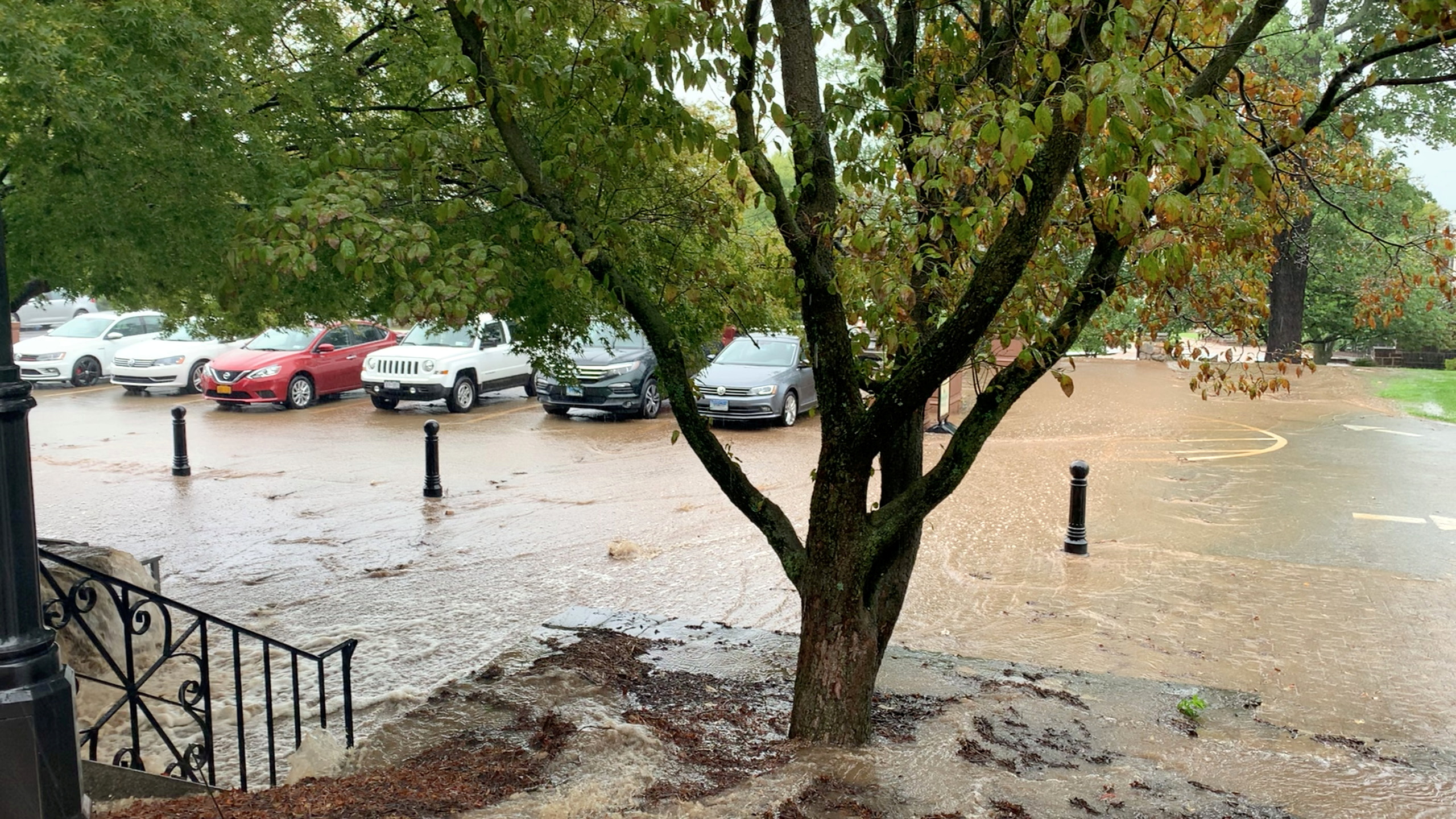 A flooded parking area is seen during flash floods in Emmitsburg, Maryland, U.S., September 1, 2021, in this still image taken from video obtained from social media. Mandatory credit JOHNNY BRUSA/via REUTERS 