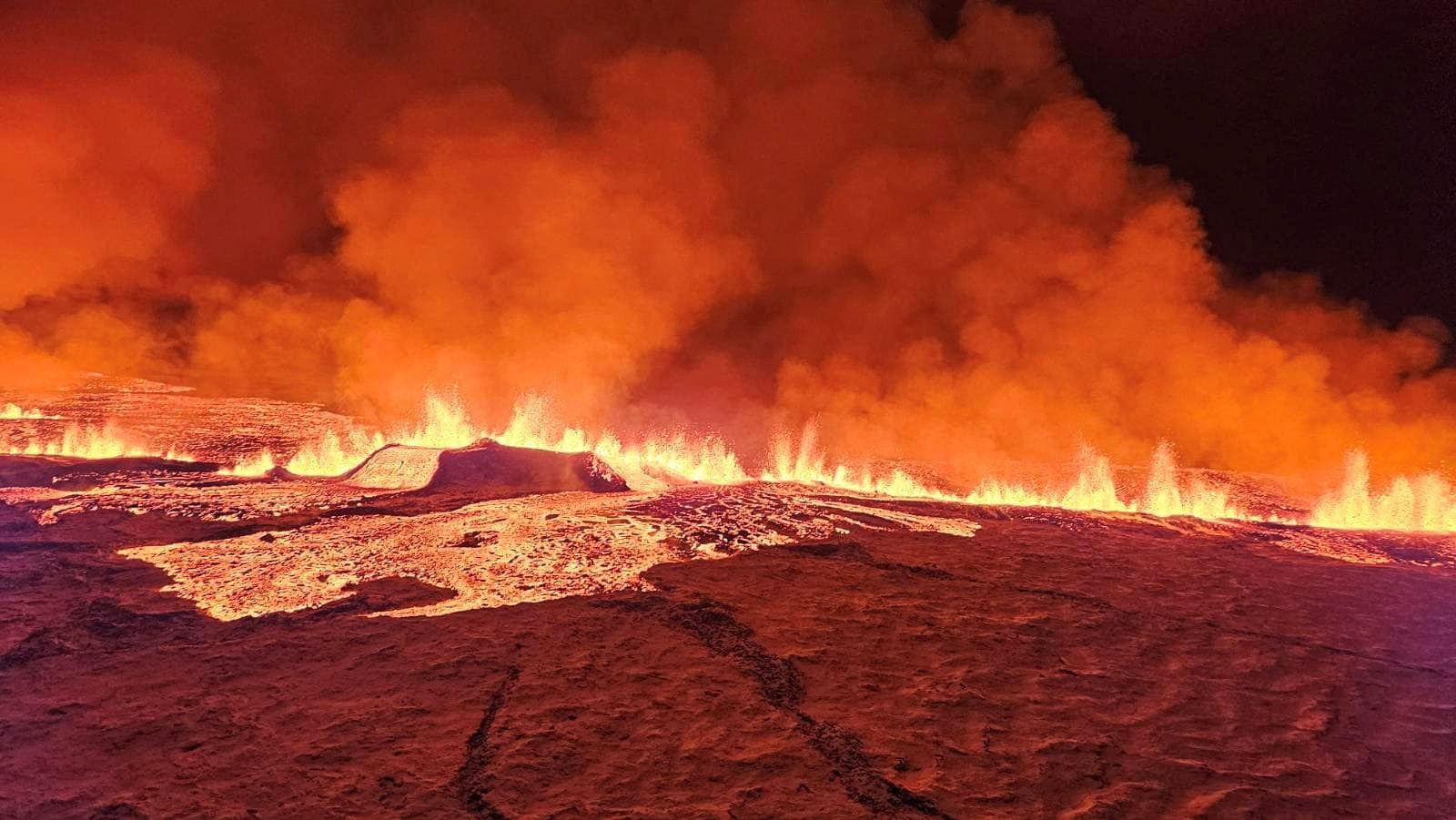 A volcano spews lava and smoke as it erupts in Grindavik