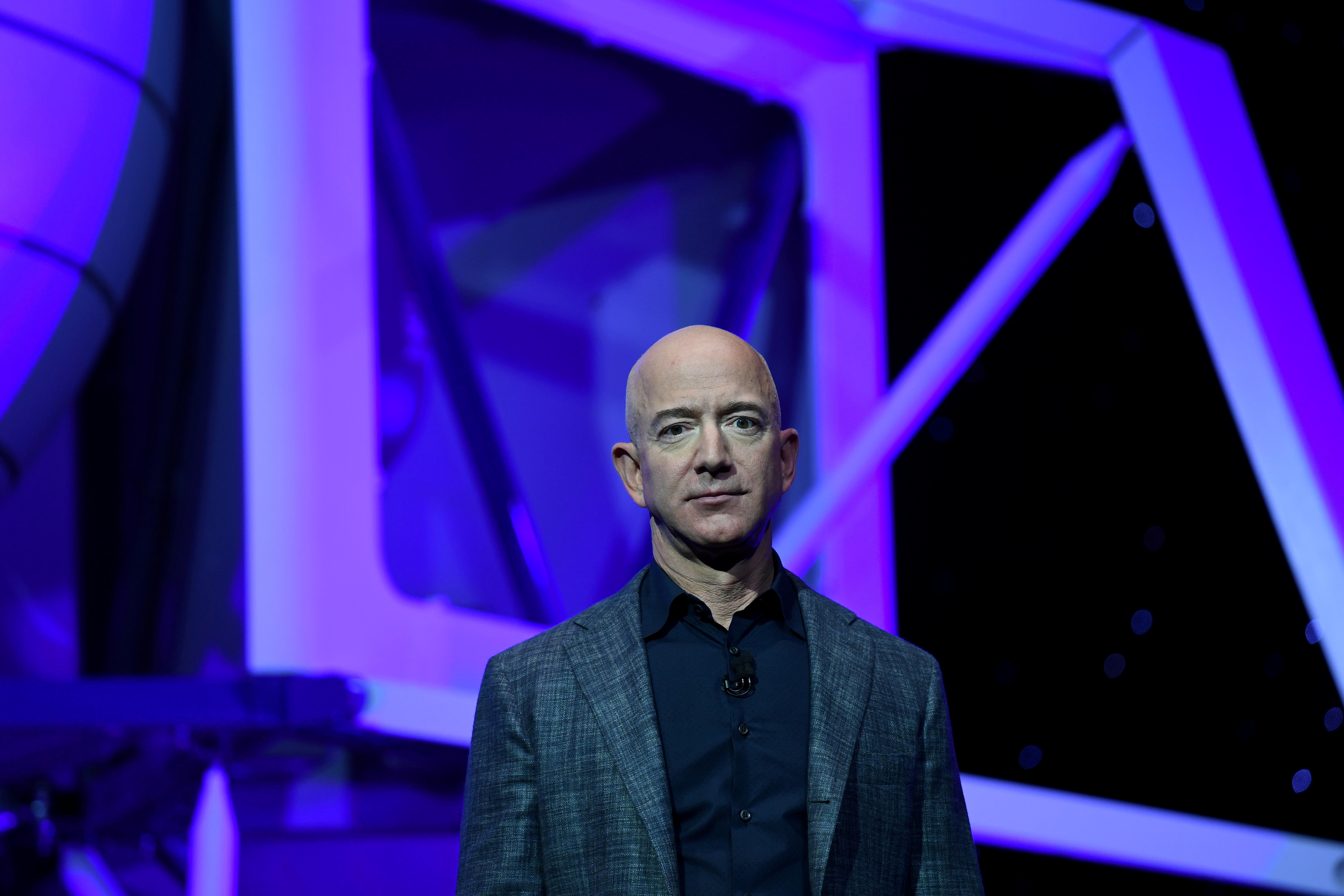 FILE PHOTO: Founder, Chairman, CEO and President of Amazon Jeff Bezos unveils his space company Blue Origin's space exploration lunar lander rocket called Blue Moon during an unveiling event in Washington