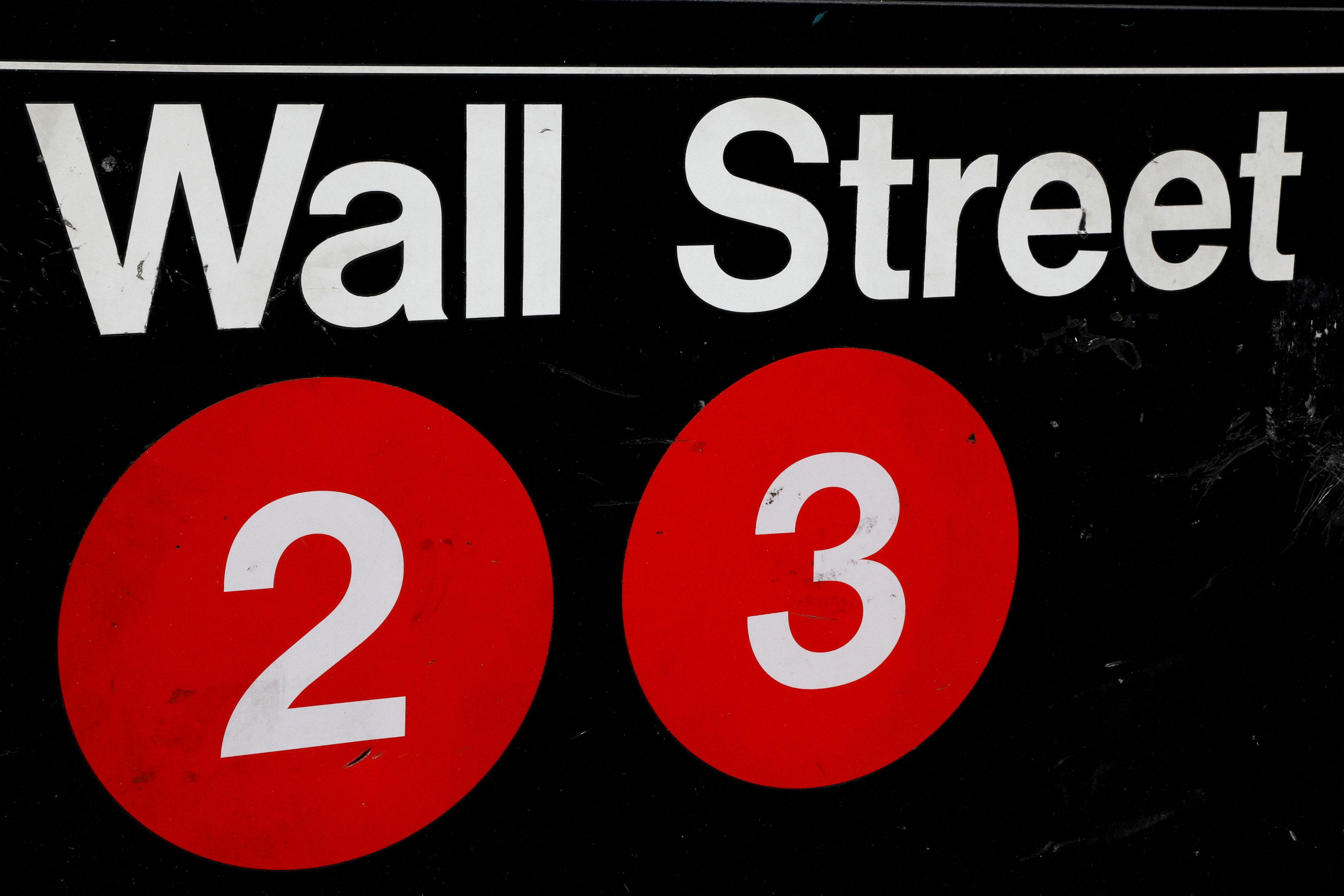 FILE PHOTO: FILE PHOTO: A sign for the Wall Street subway station is seen in the financial district in New York