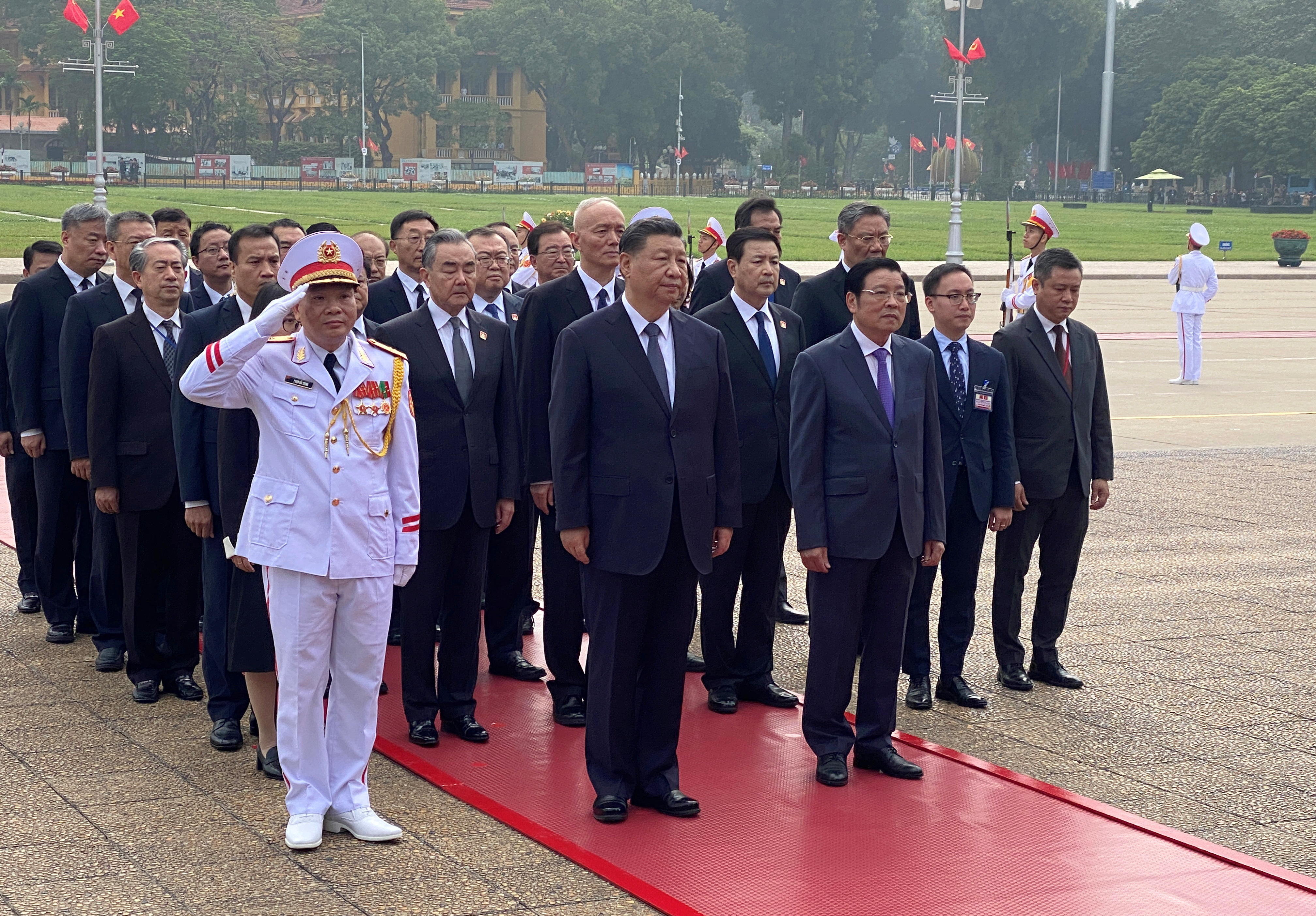 Chinese President Xi Jinping attends a  lay wreath ceremony at the Ho Chi Minh mausoleum during a two day state visit to Hanoi