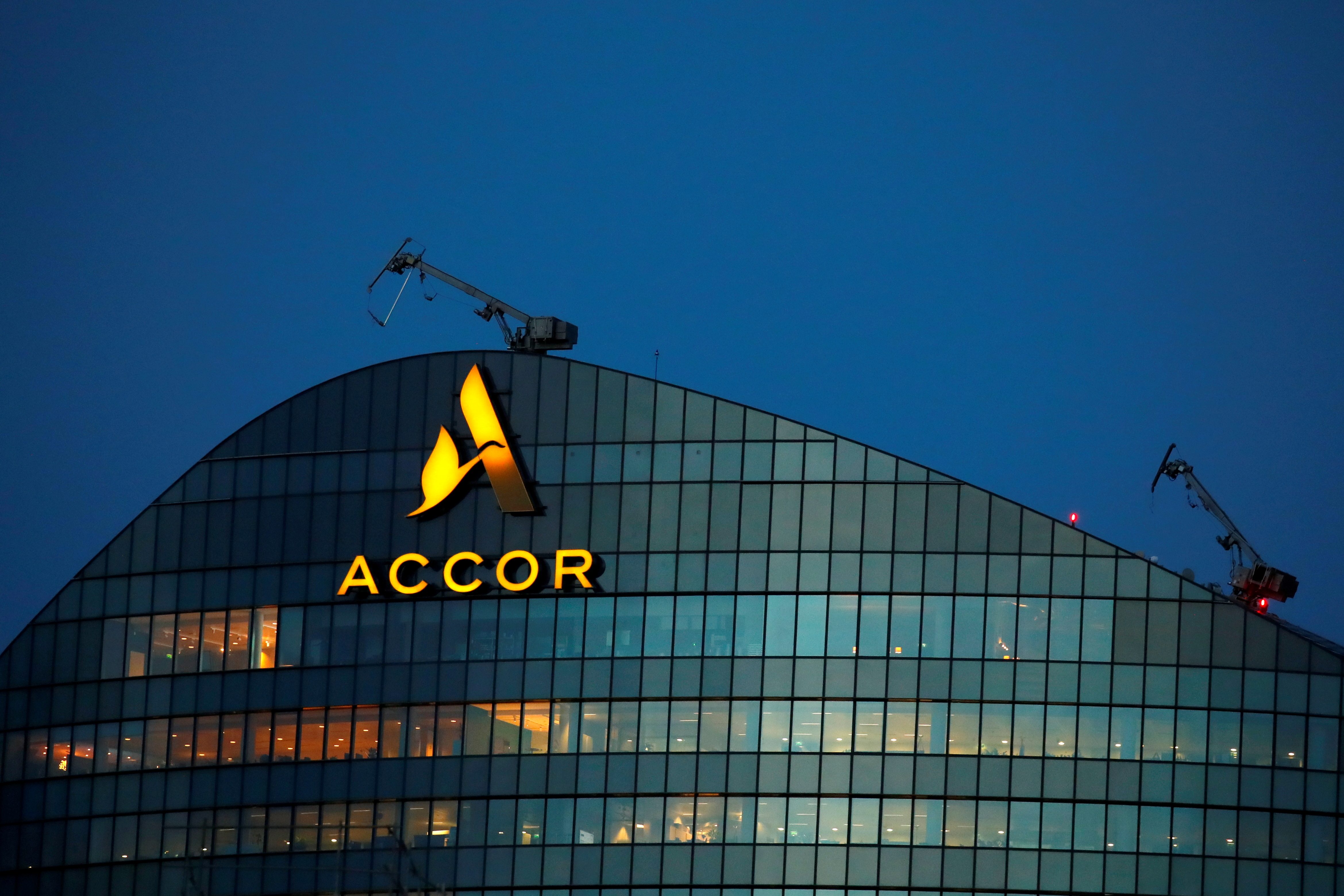 The logo of French hotel operator AccorHotels is seen on top of the company's headquarters near Paris