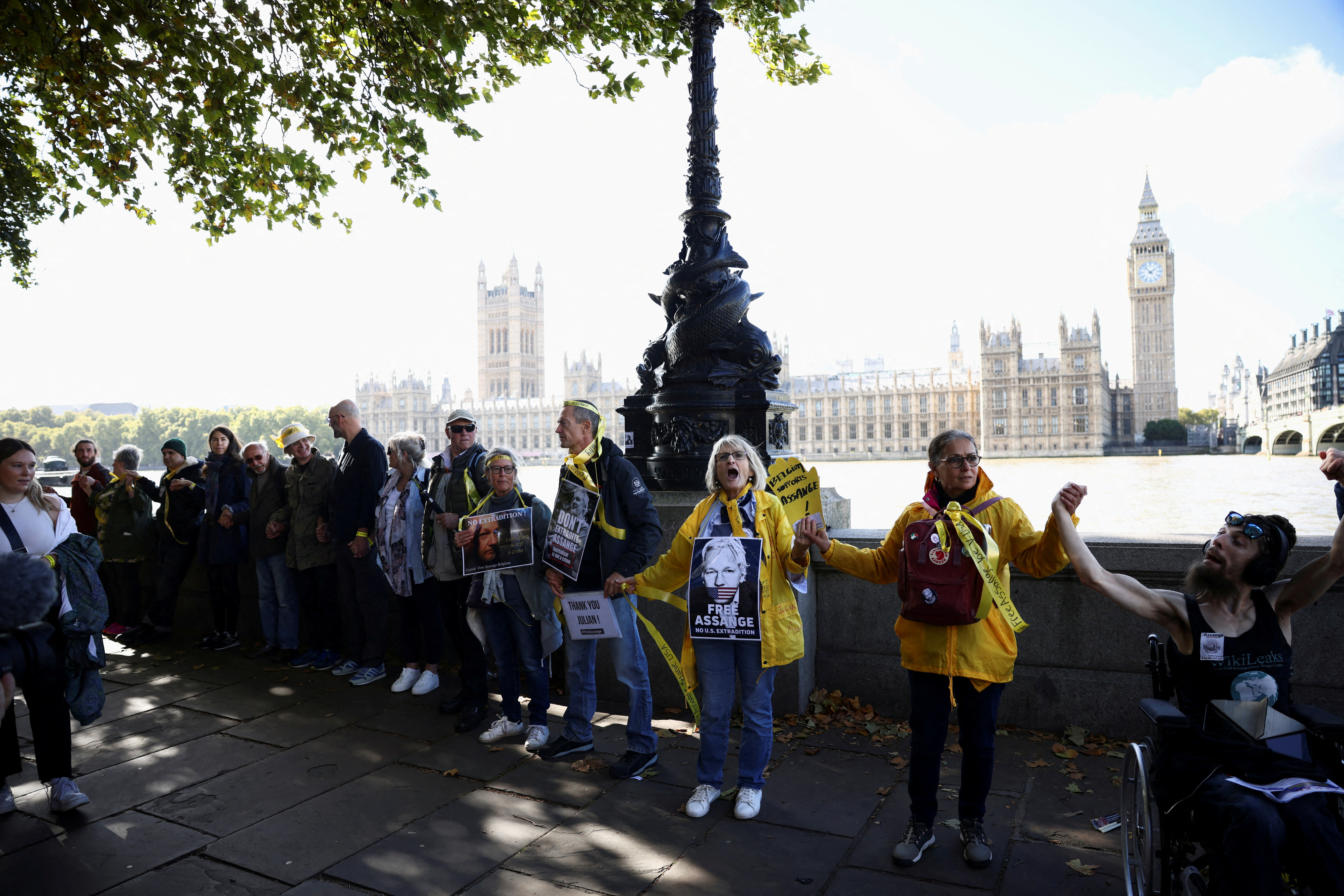 Supporters of WikiLeaks founder Julian Assange create human chain around Westminster in London