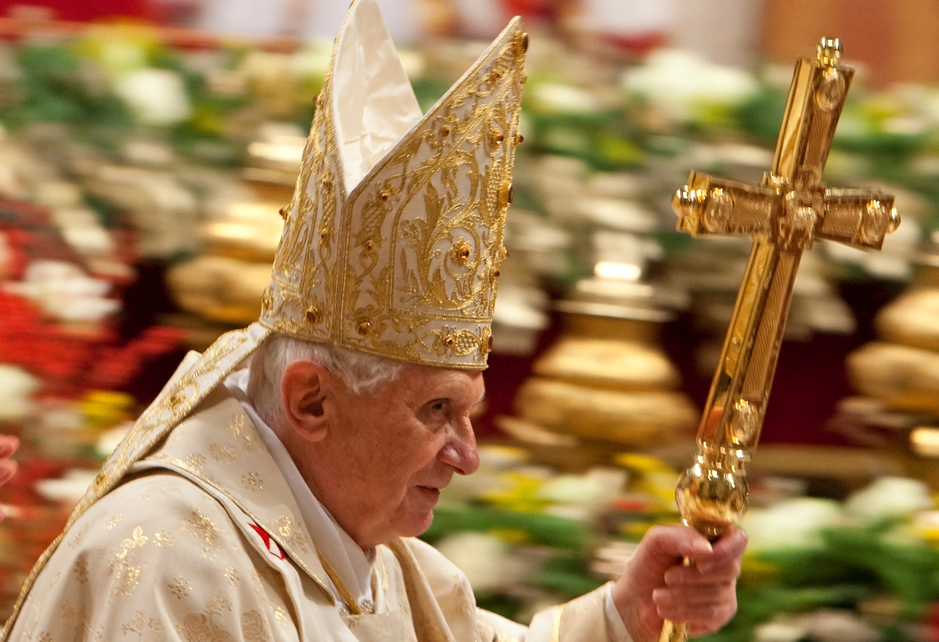 Pope Benedict XVI leaves at the end of the Christmas mass in Saint Peter's Basilica at the Vatican