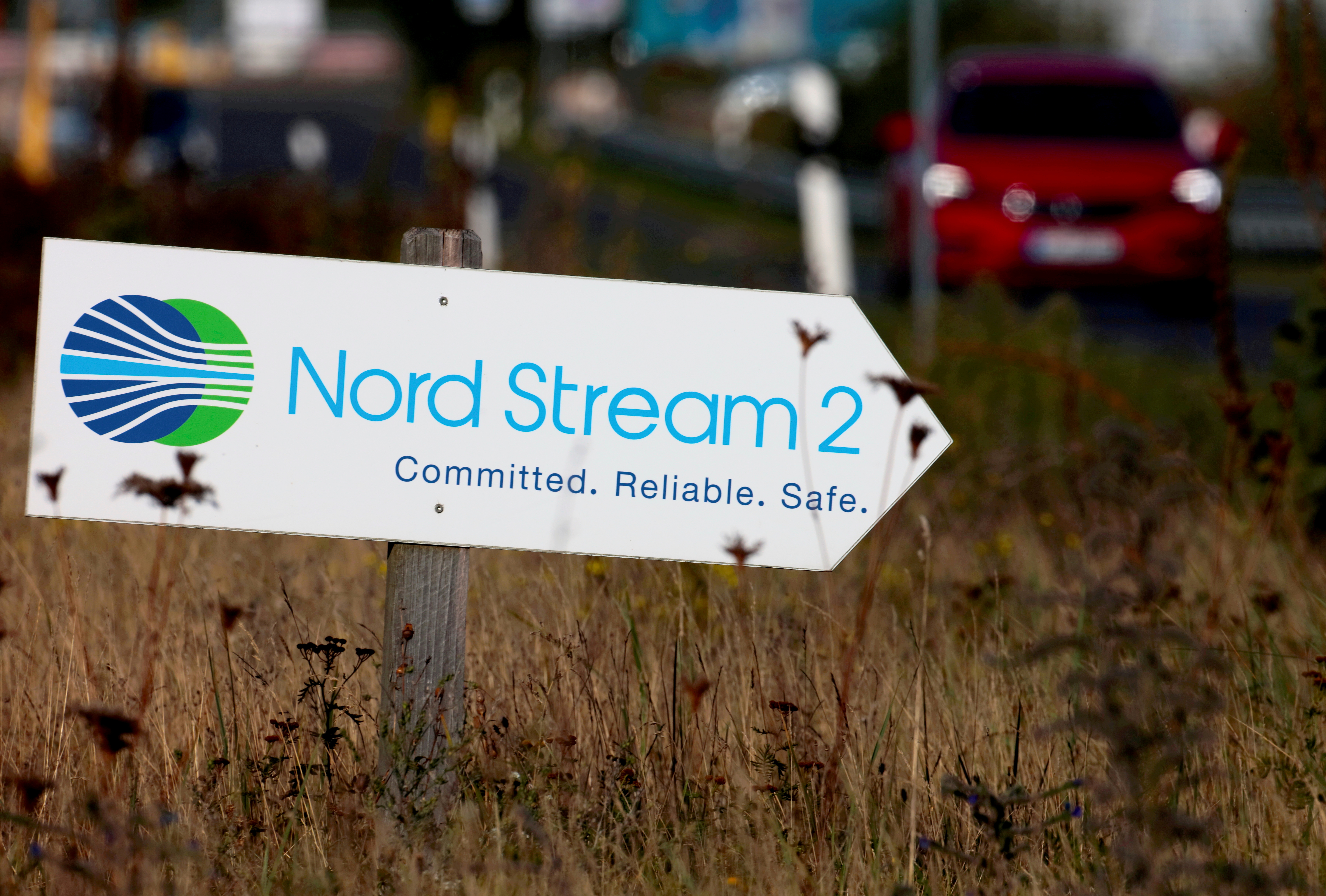 A road sign directs traffic towards the Nord Stream 2 gas line landfall facility entrance in Lubmin, Germany, September 10, 2020.   REUTERS/Hannibal Hanschke