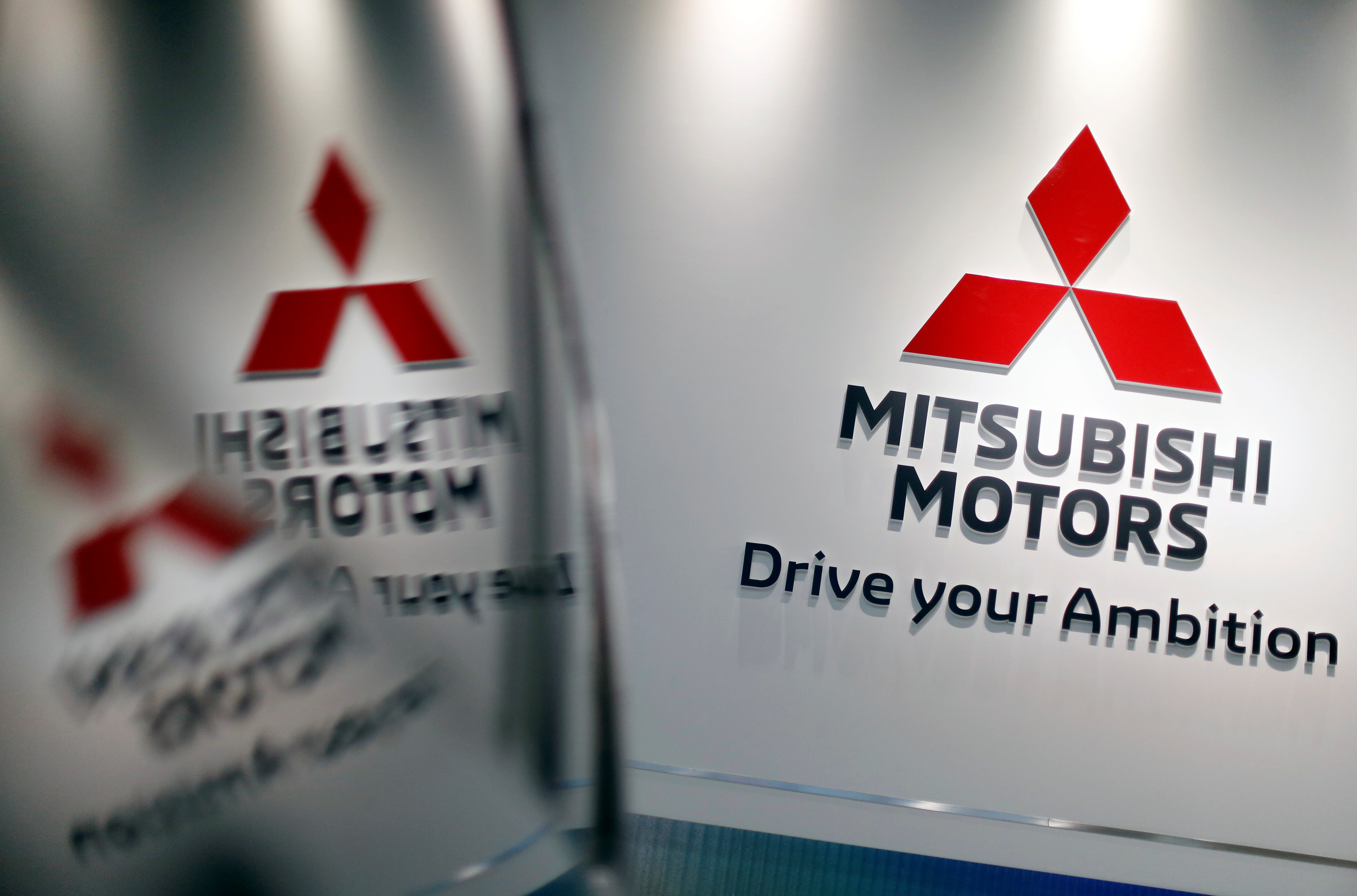 The logo of Mitsubishi Motors Corp is displayed at the company's showroom in Tokyo